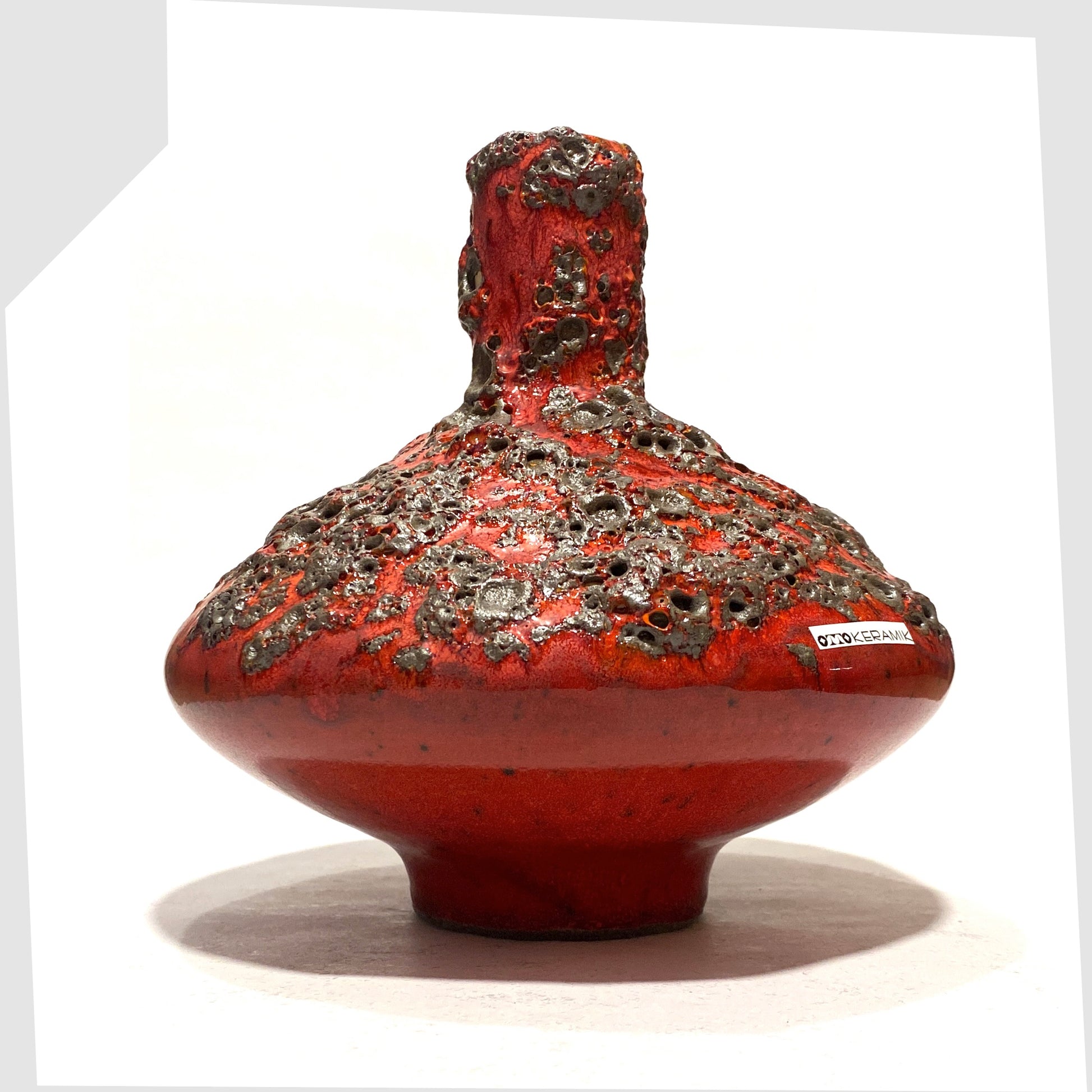 Otto Keramik 206M Vase in a rich red glaze with yellow hues around the rim and deep fat lava glazing, shown on a white background