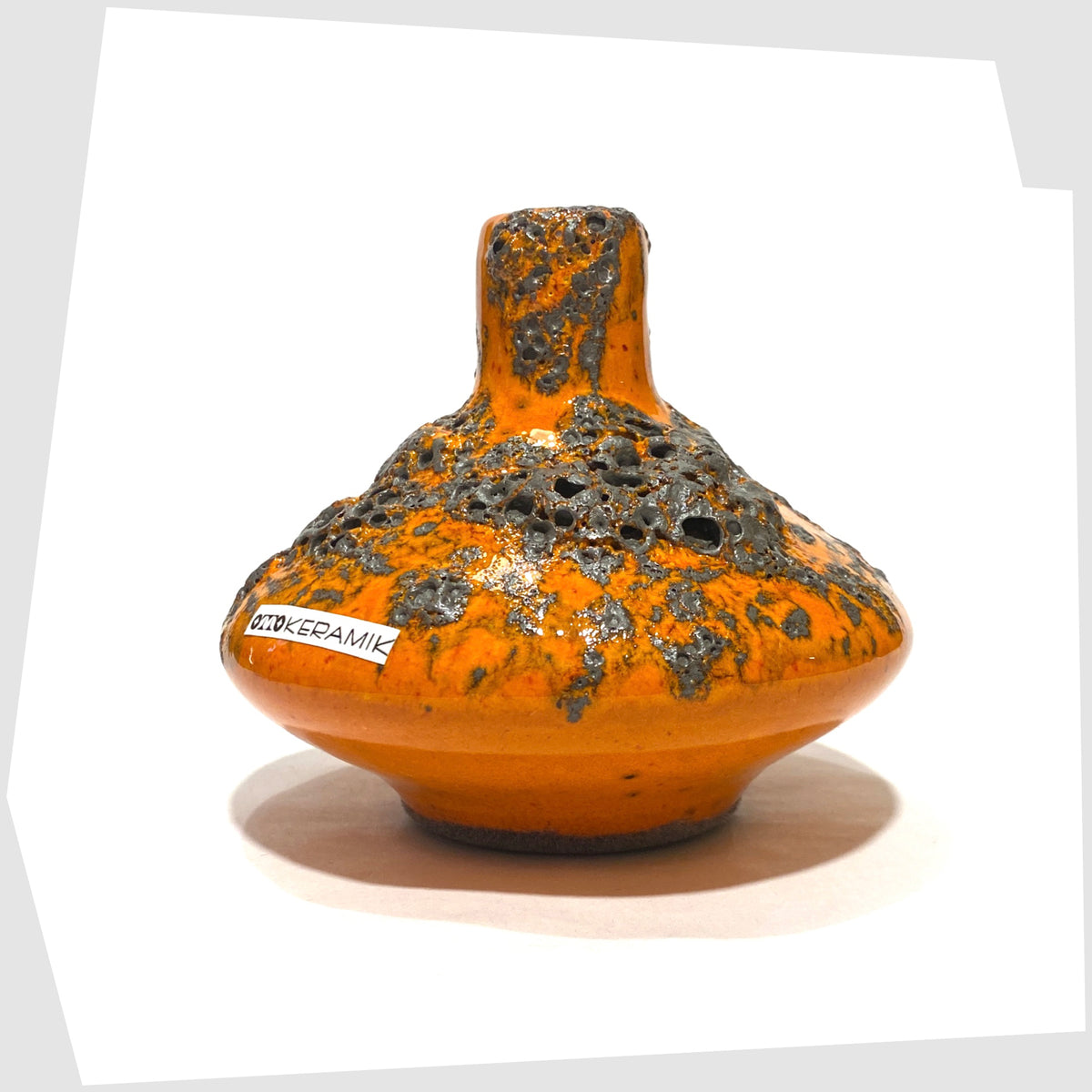 West German Pottery-style Otto Keramik 206s Vase in a vibrant orange glaze with grey fat lava, shown on a white background