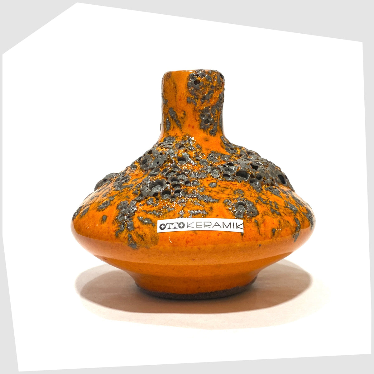 Otto Keramik 206s Vase in a vibrant orange glaze with grey fat lava, shown on a white background