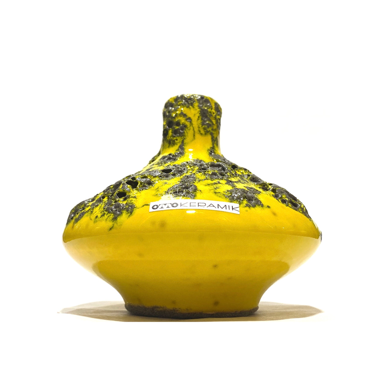 West German Pottery-style Otto Keramik 206s Vase in a vibrant yellow glaze with grey fat lava, shown on a white background