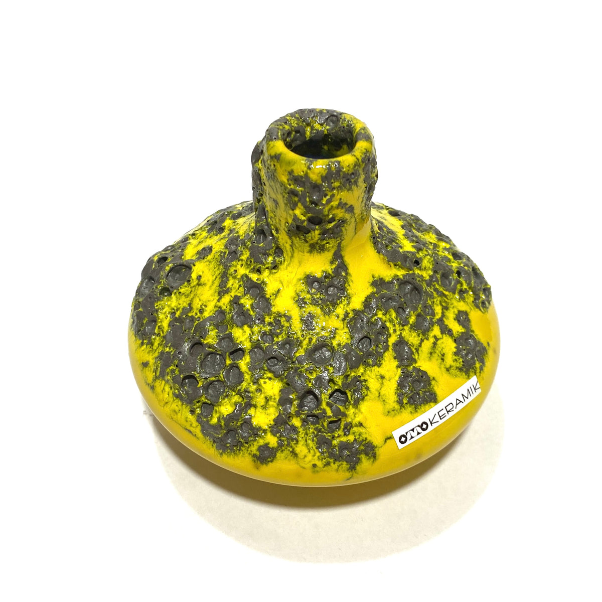 top view of the Otto Keramik 206s Vase in a vibrant yellow glaze with grey fat lava, shown on a white background