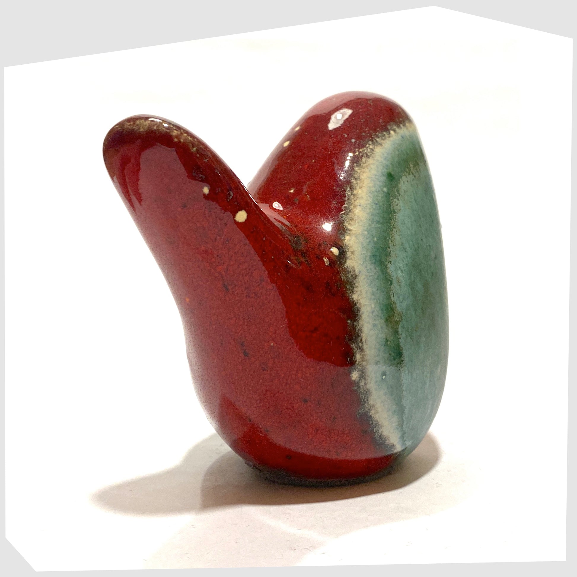 tail of the bolivia glazed otto keramik ceramic bird in red and sea green