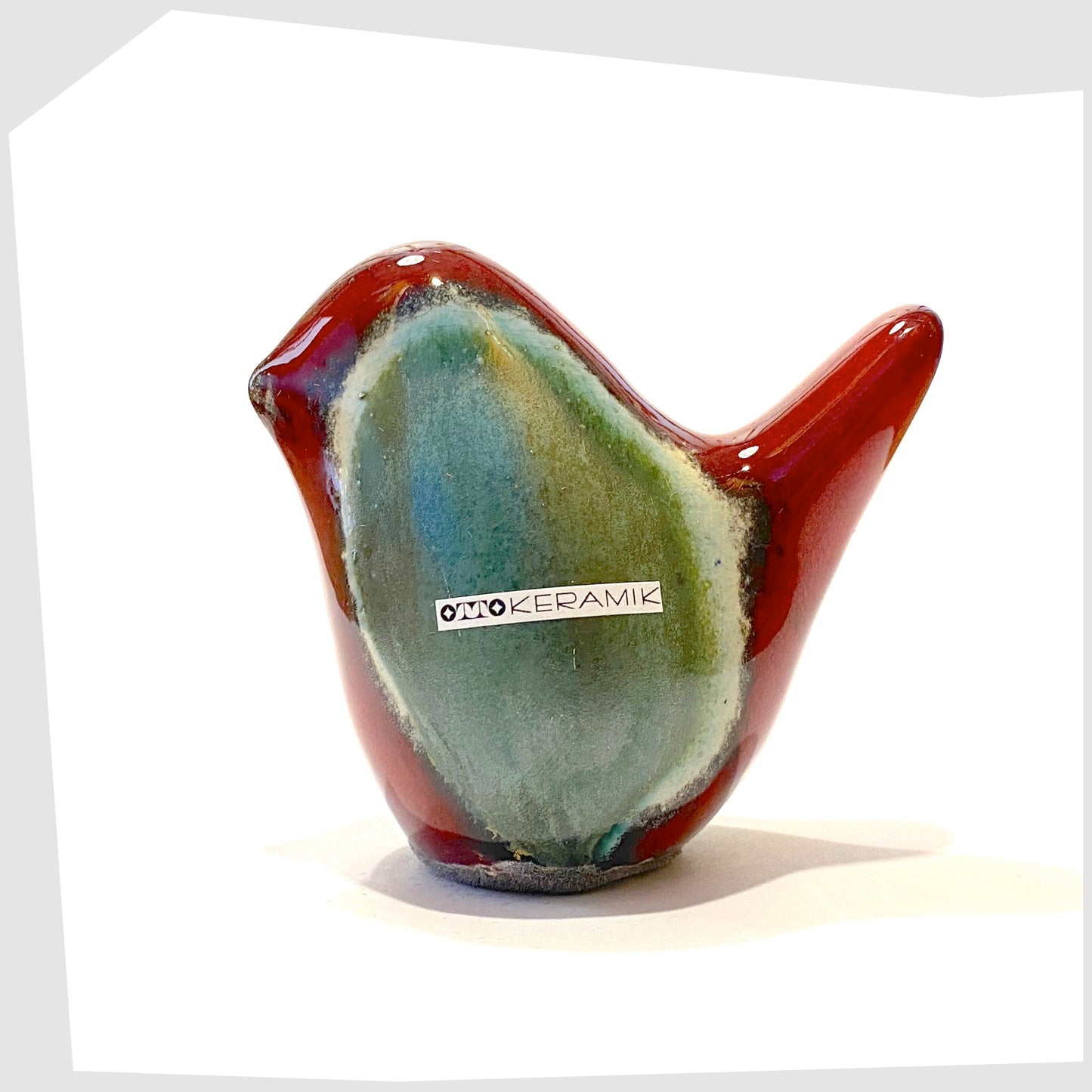 otto keramik ceramic bird sculpture in bolivia glaze of dark red and rich sea green