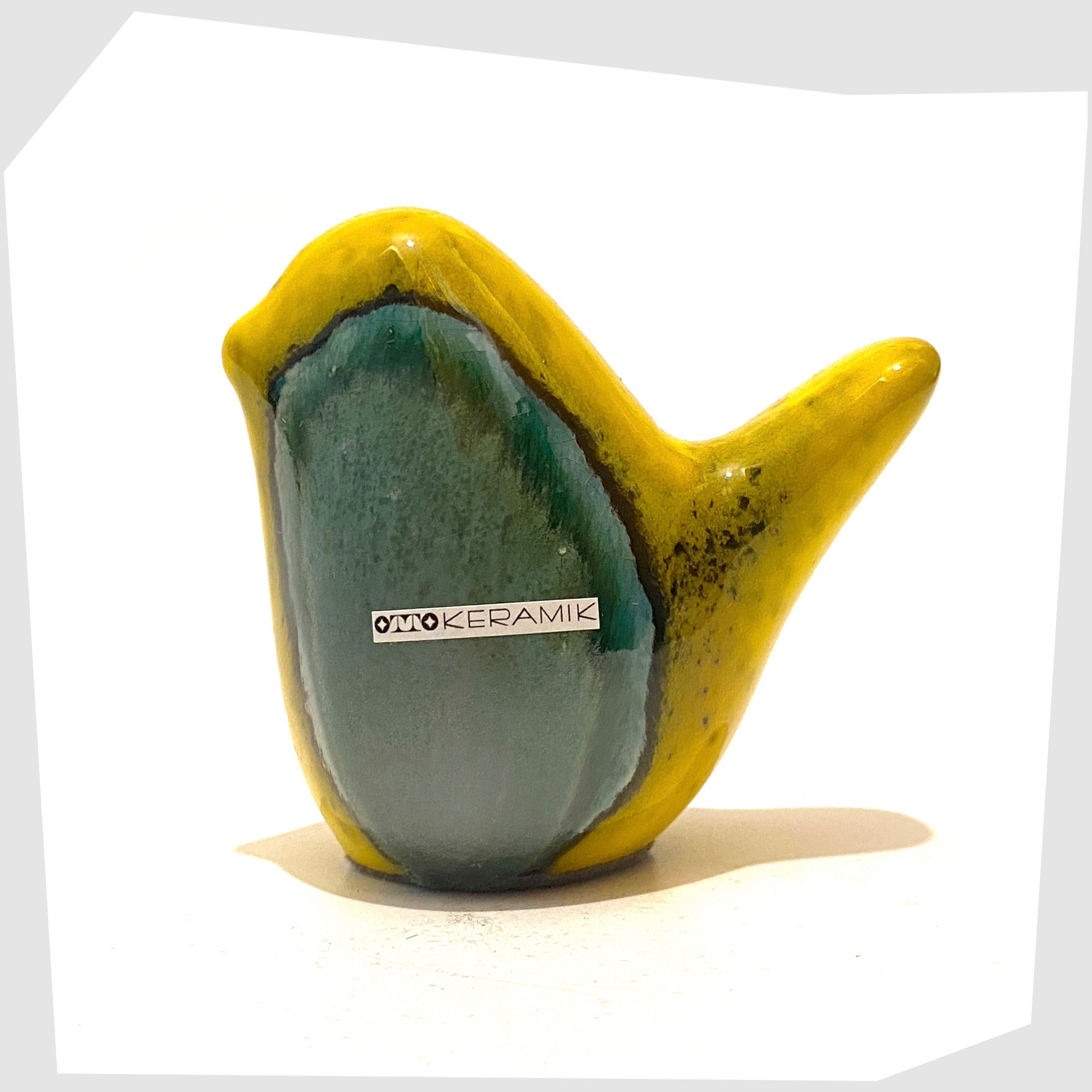 otto-keramik-bird-ornament-in-yellow-and-sea-green-drip-glaze