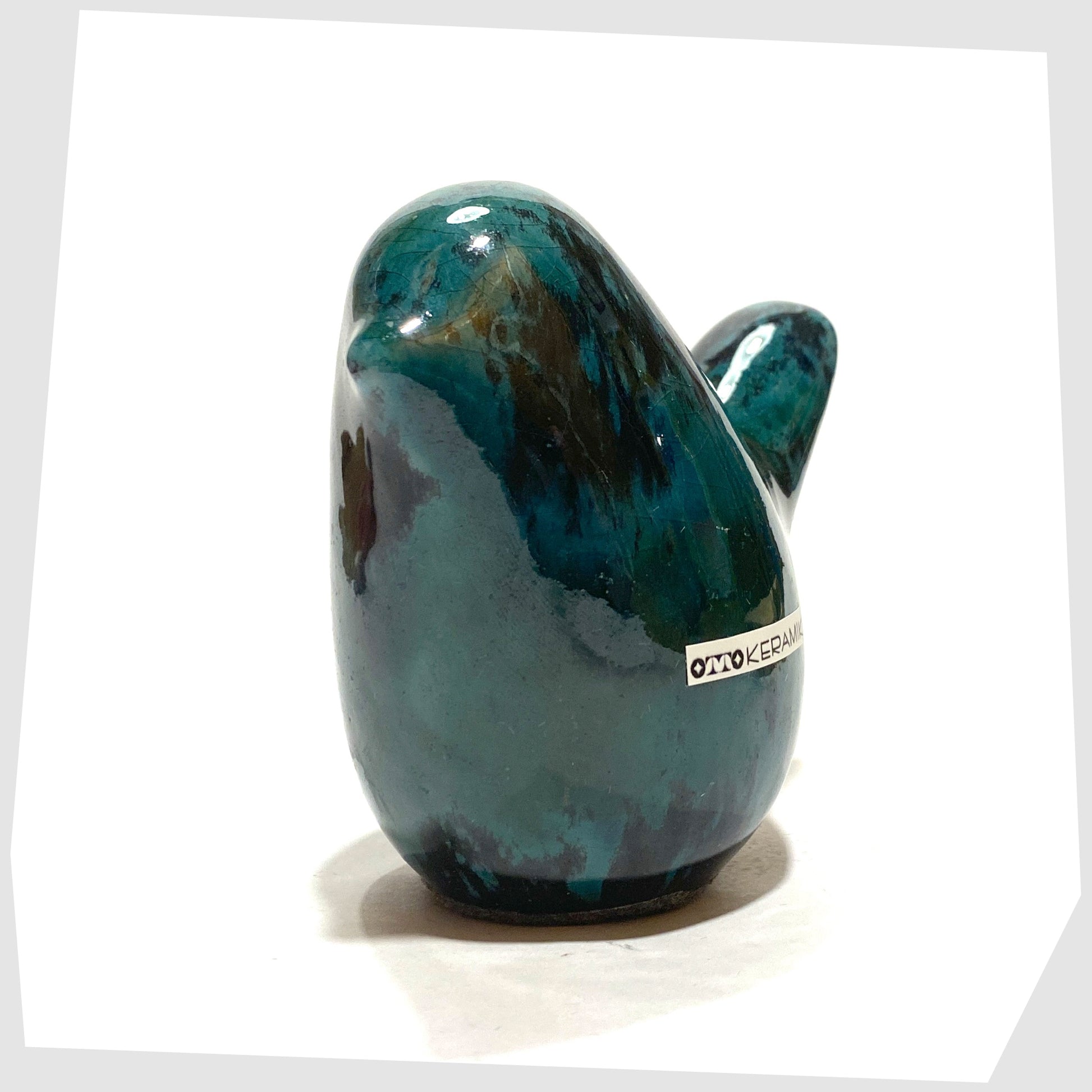 ceramic bird ornament in Ecuador glaze of teal and black by Otto Keramik, Germany