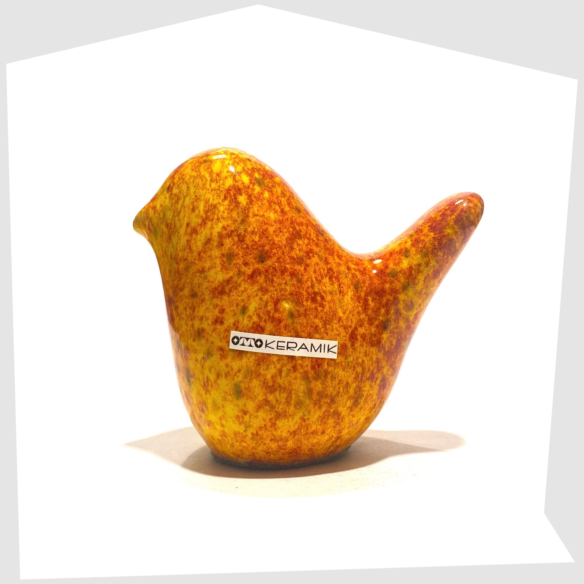 otto keramik ceramic bird in fire glaze of red, orange and yellow speckles
