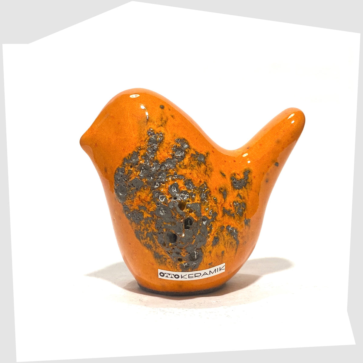Otto Keramik Ceramic Bird in Orange Fat Lava Glaze shown on a white background