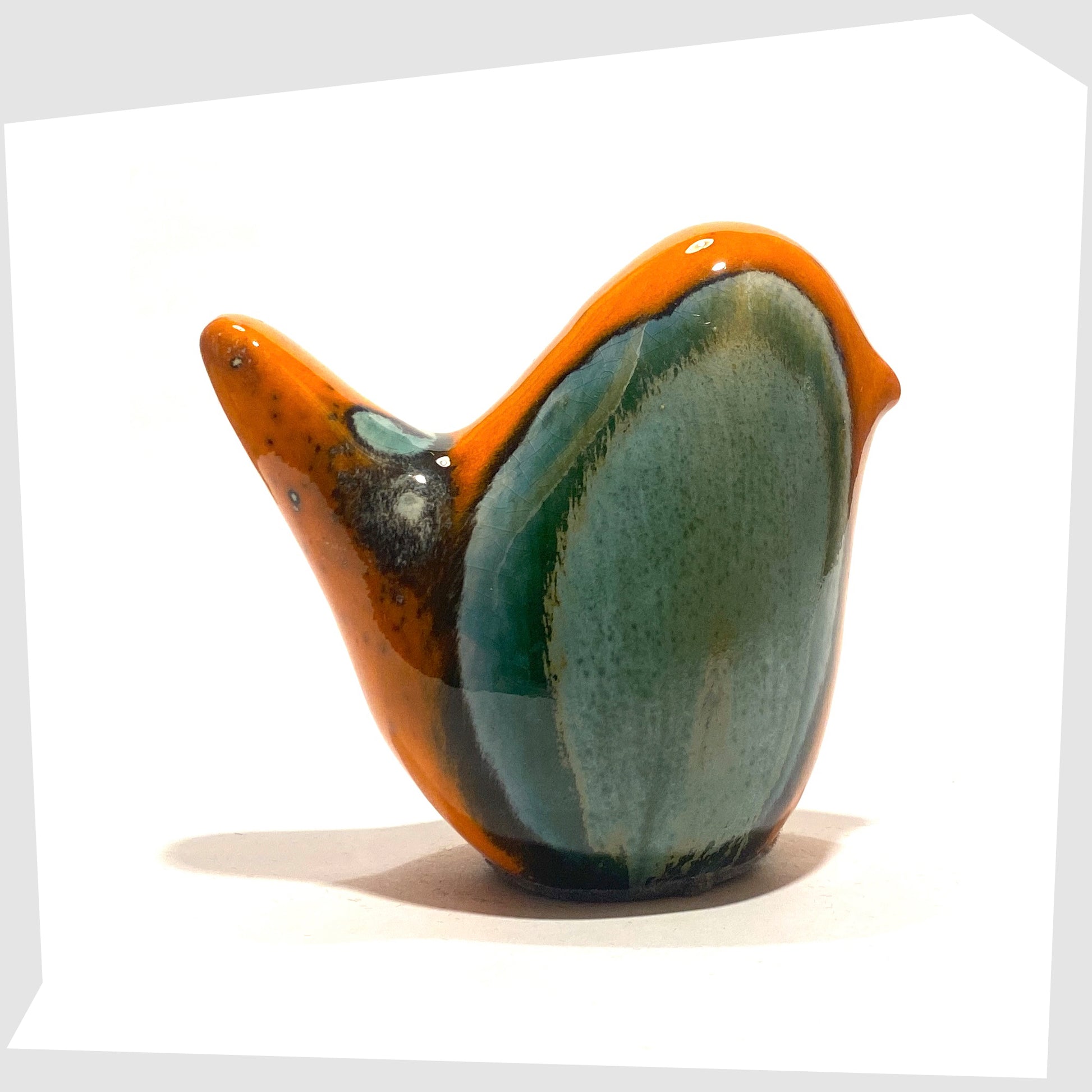 ceramic bird in peru glaze of orange and sea green by otto keramik, germany