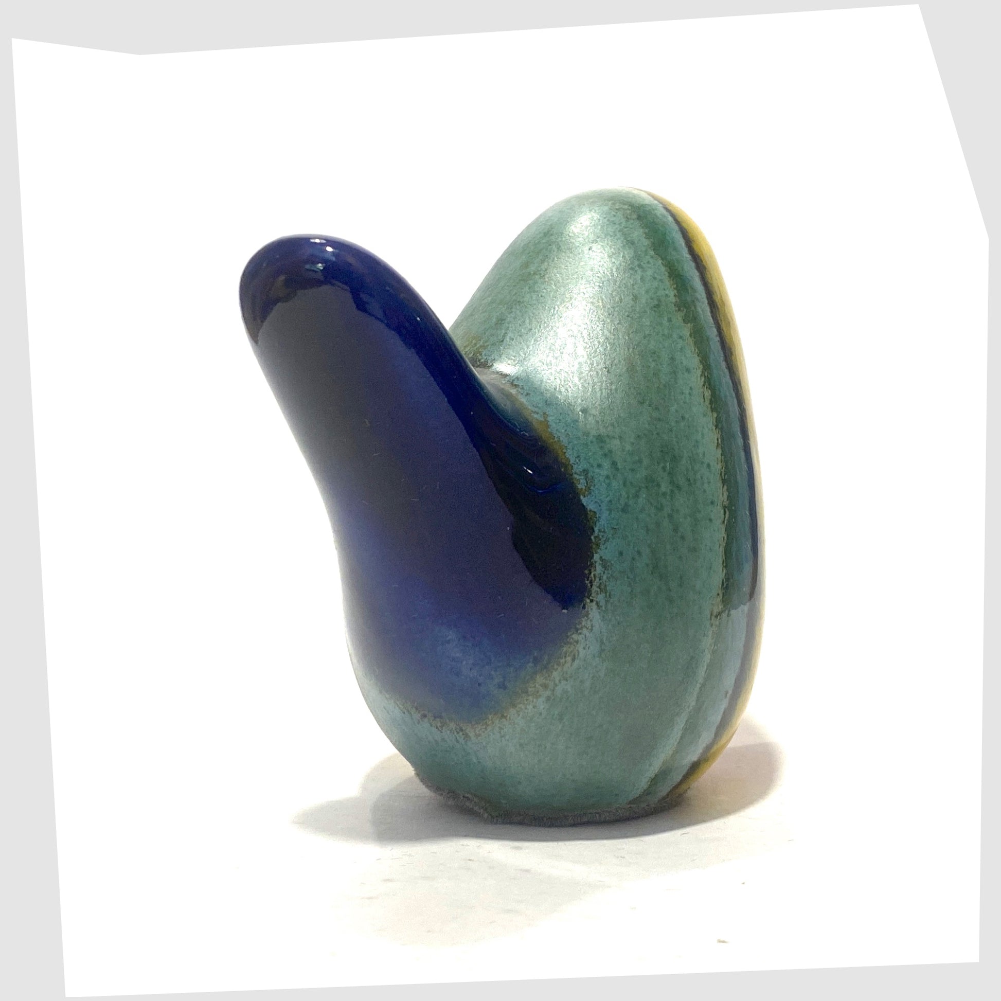 west german pottery-style ceramic bird in rainbow coloured glaze by otto keramik, tail angled view