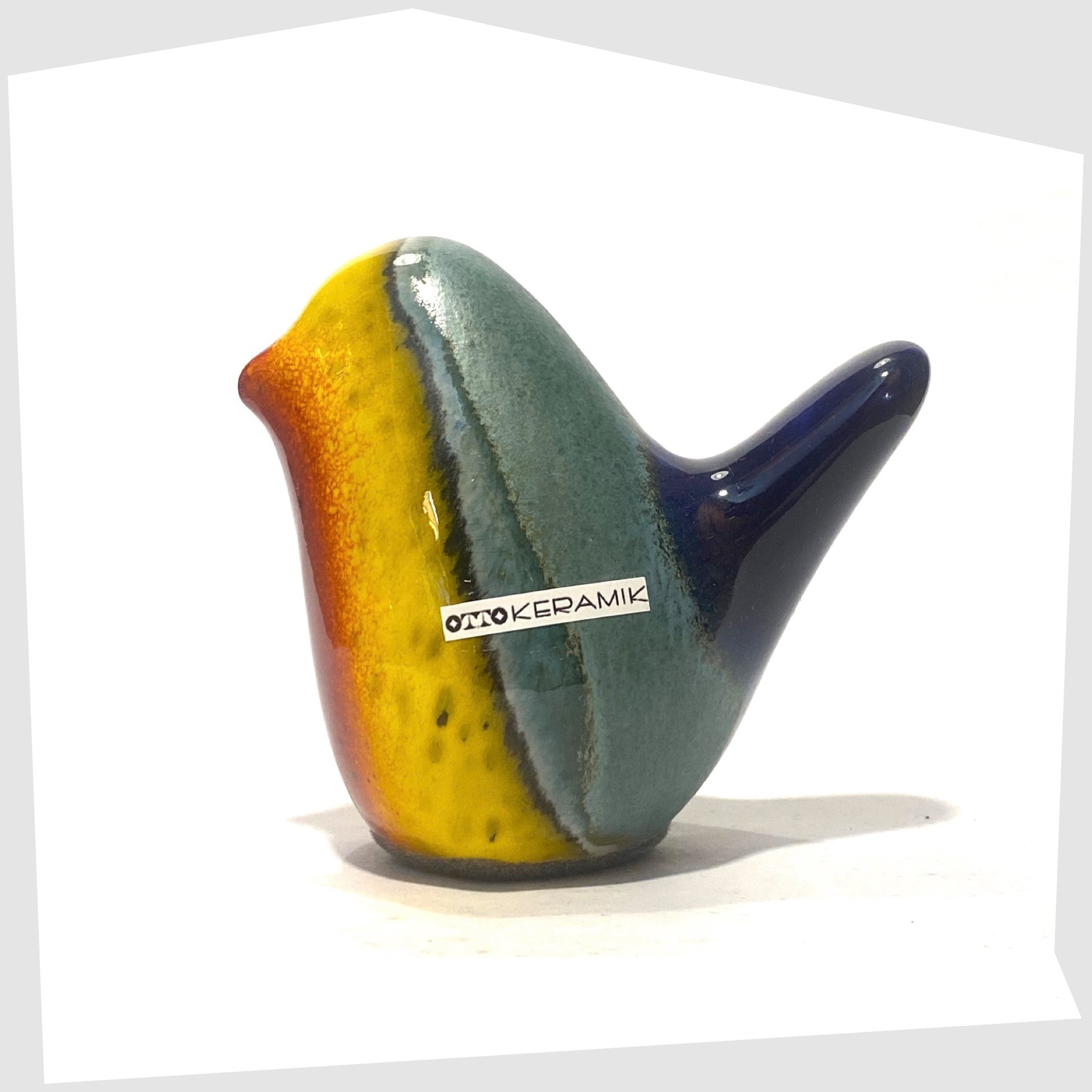 otto keramik ceramic bird sculpture in multicoloured rainbow glaze shown on a white background
