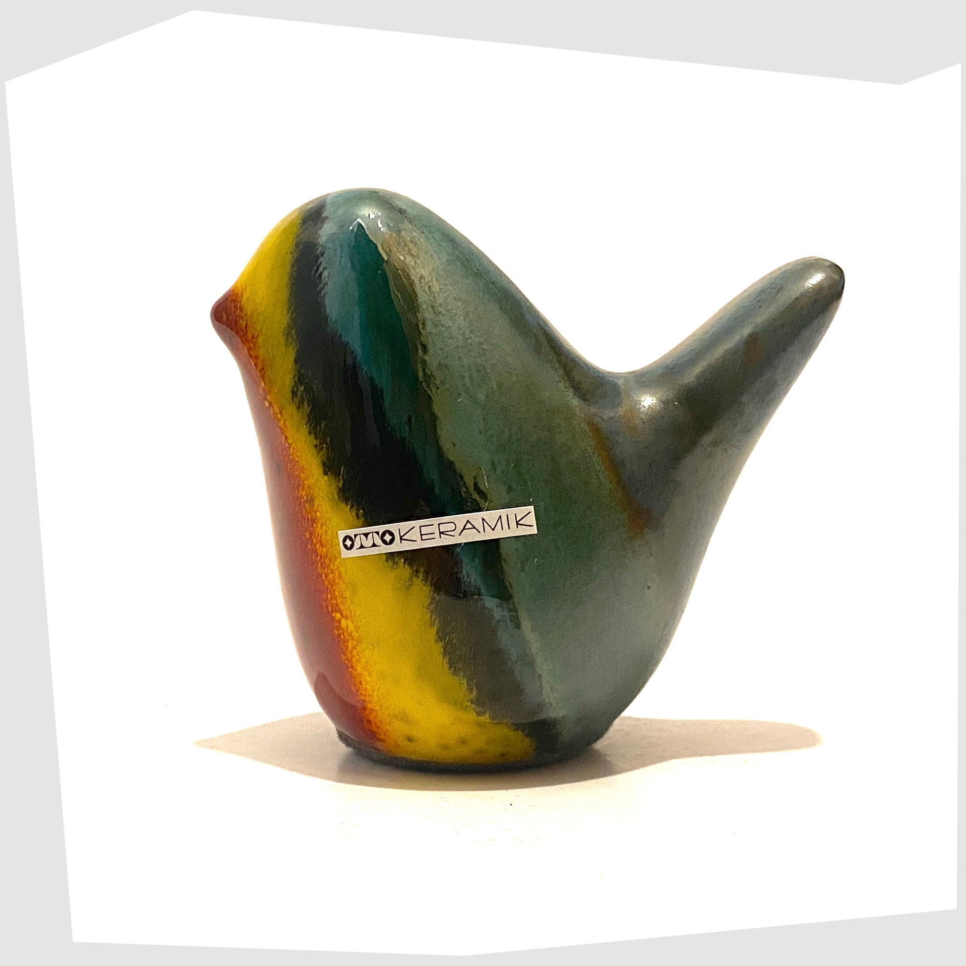 otto-keramik-bird-in-multicoloured-rainbow-glaze-of-red-yellow-and-green-stripes