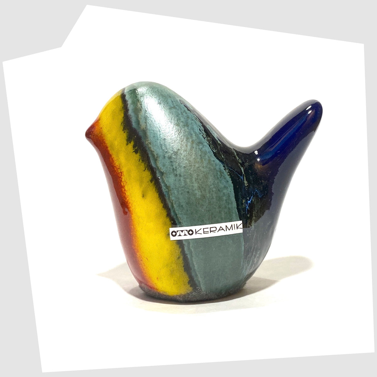 otto keramik ceramic bird sculpture in multicoloured rainbow glaze shown on a white background