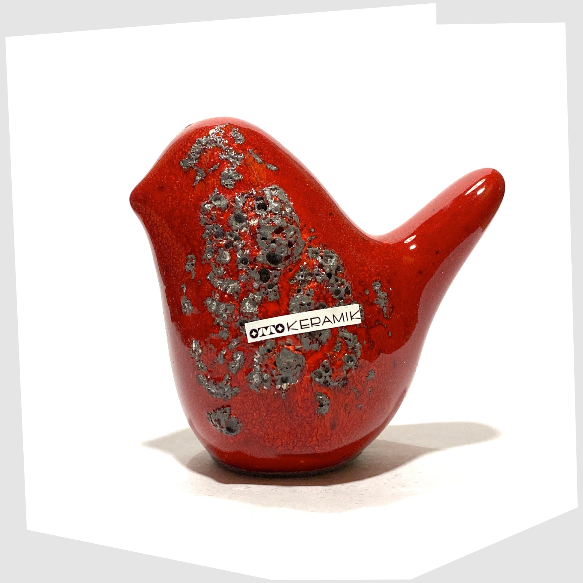 otto keramik ceramic bird in red with grey fat lava glaze.