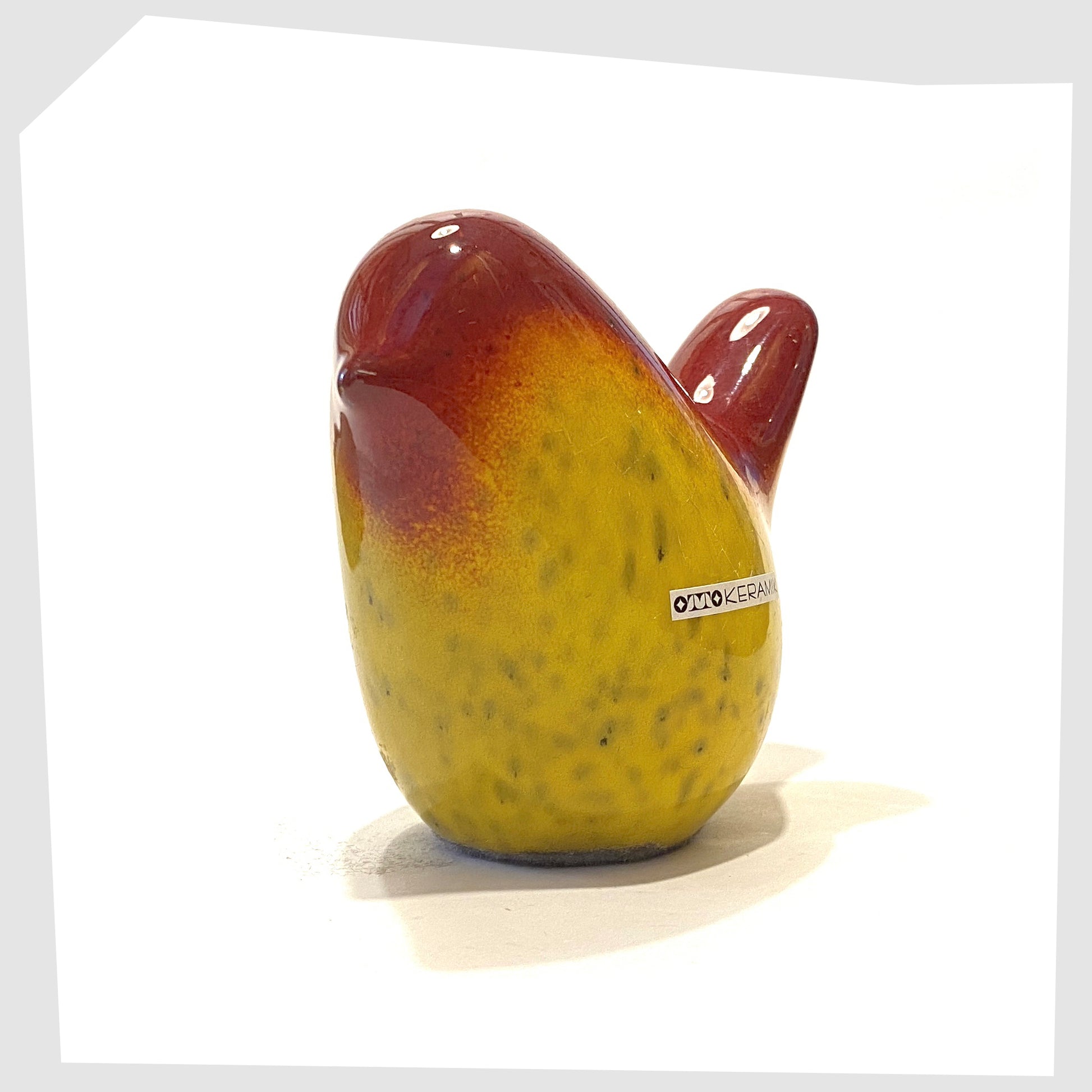 otto keramik ceramic bird glazed in rich red over vibrant yellow