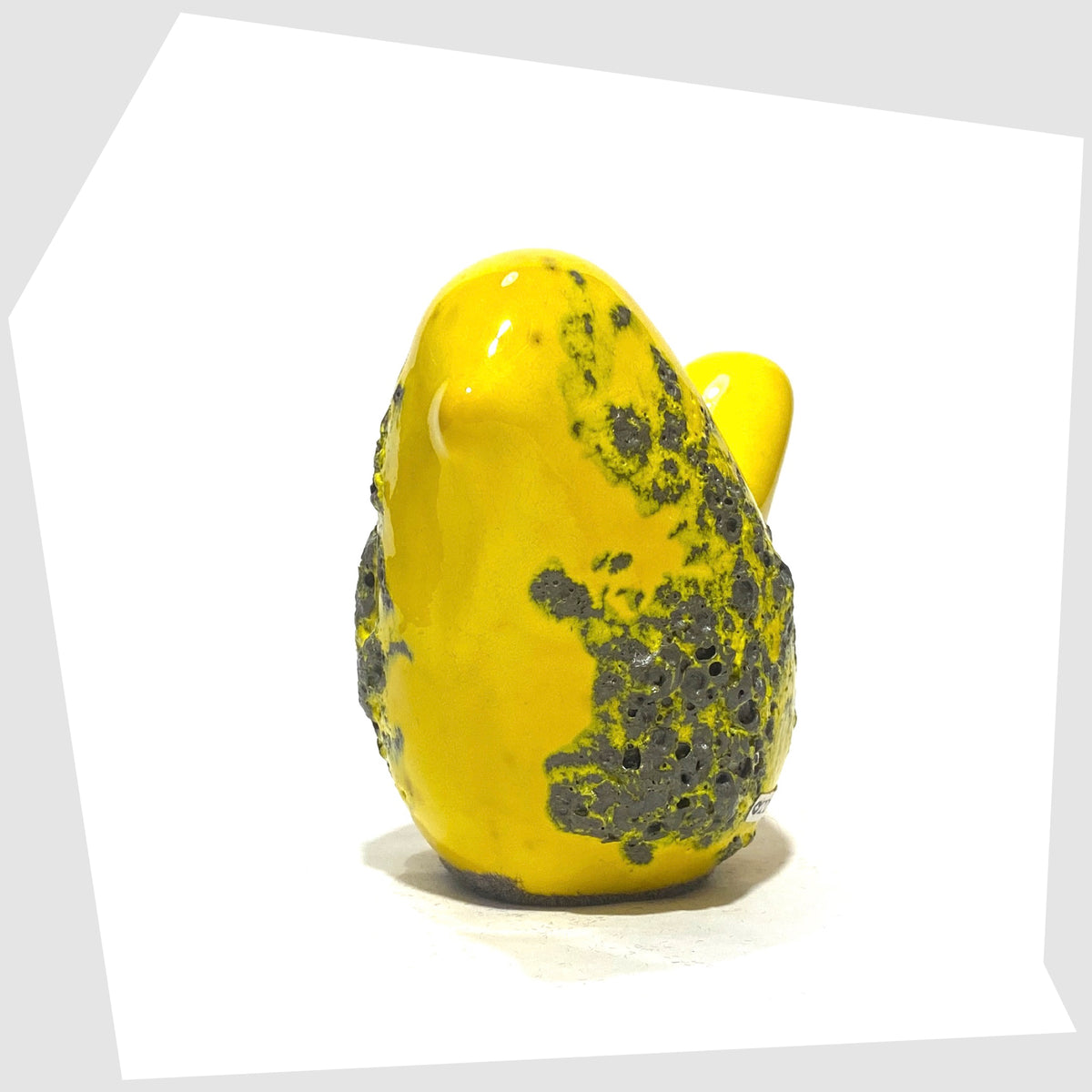Front of the Otto Keramik Ceramic Bird in yellow fat lava glaze, shown on a white background
