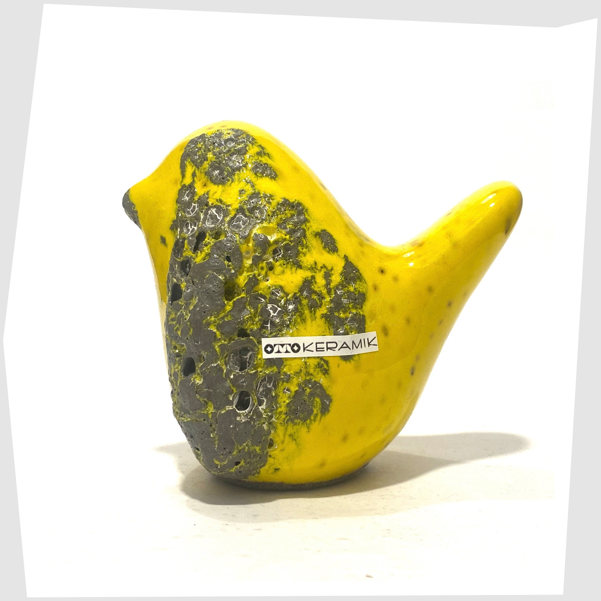 otto keramik bird sculpture in yellow with grey fat lava glaze