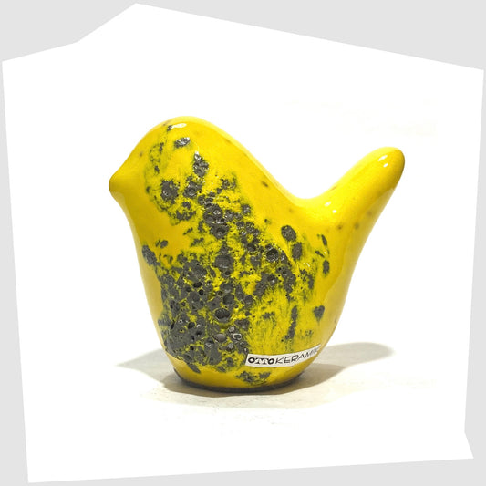 Otto Keramik Bird in yellow fat lava glaze, shown on a white background