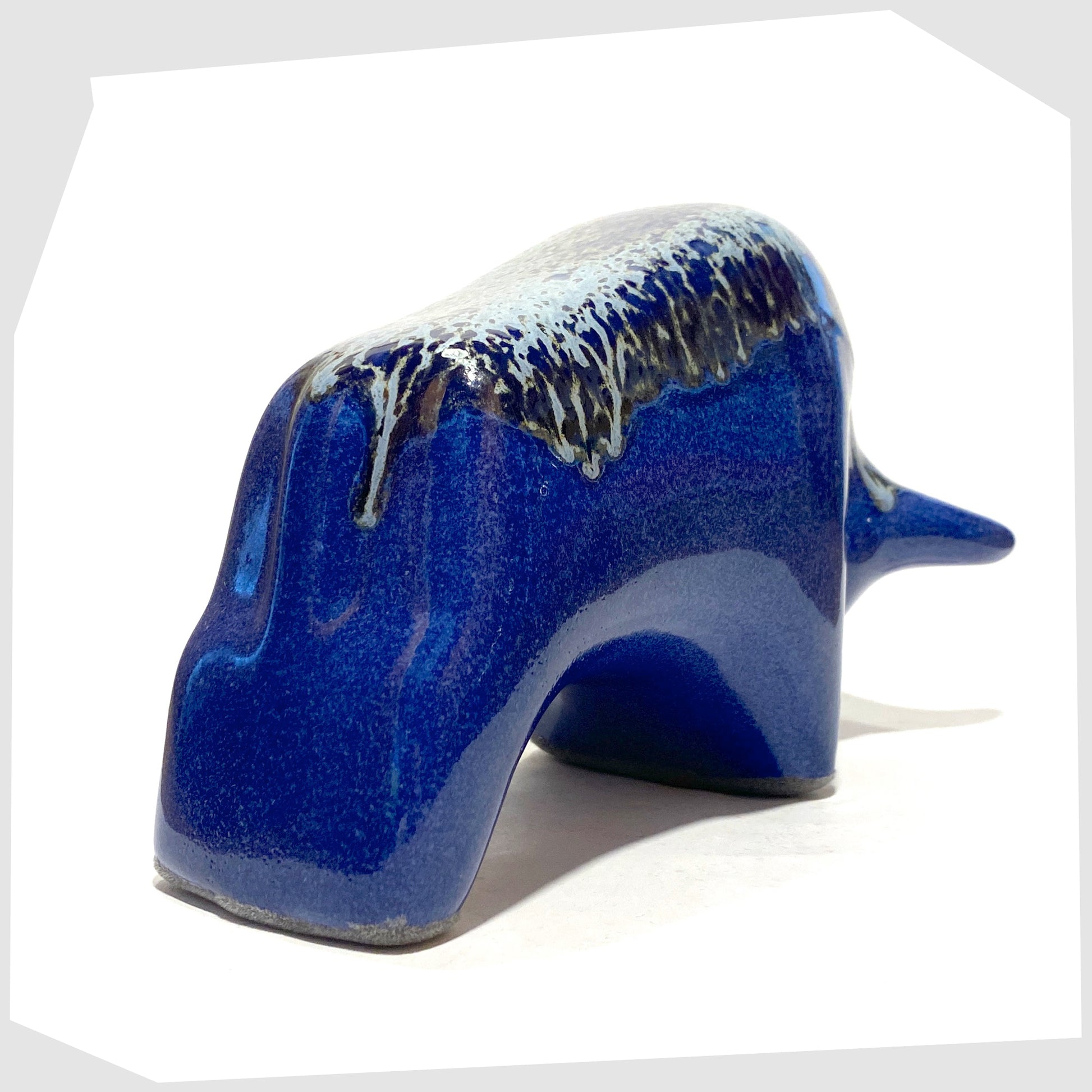 rear of the otto keramik ceramic bull in a dark blue metallic with silver bambas glaze along the spine