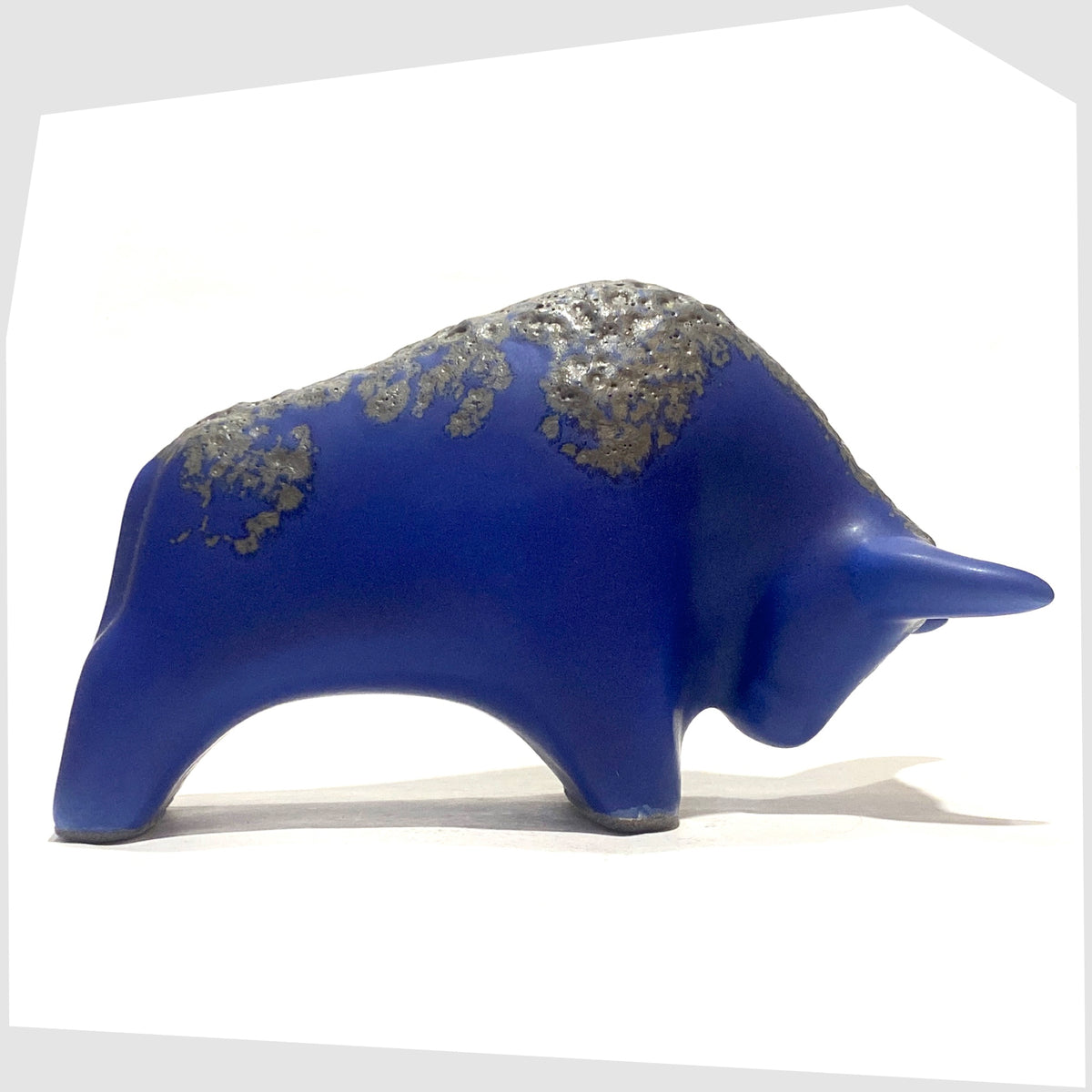 West German pottery-inspired Otto Keramik Bull-shaped ceramic ornament in blue with grey fat lava glaze, shown on a white background