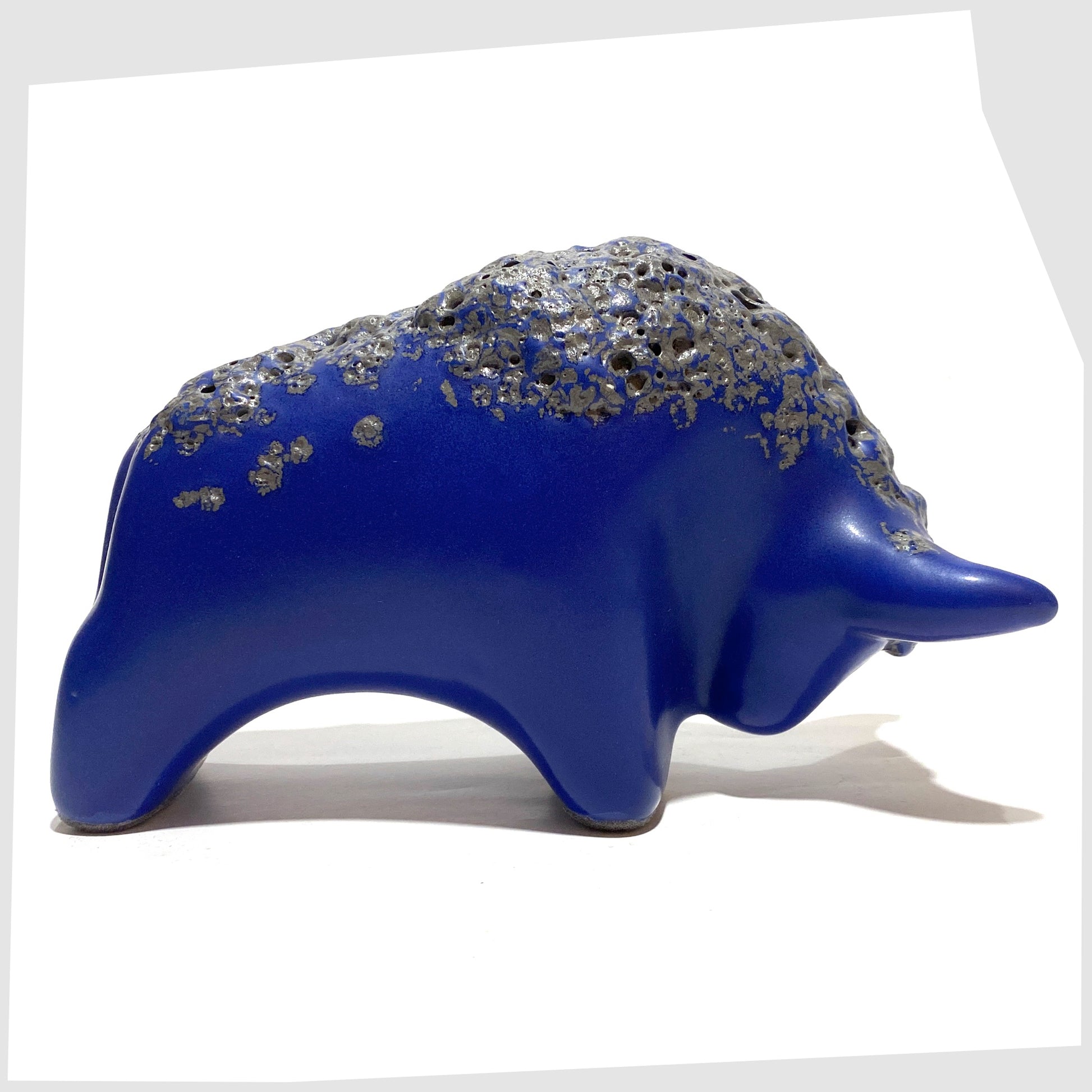 Otto Keramik bull in blue glaze with black fat lava glaze along the spine