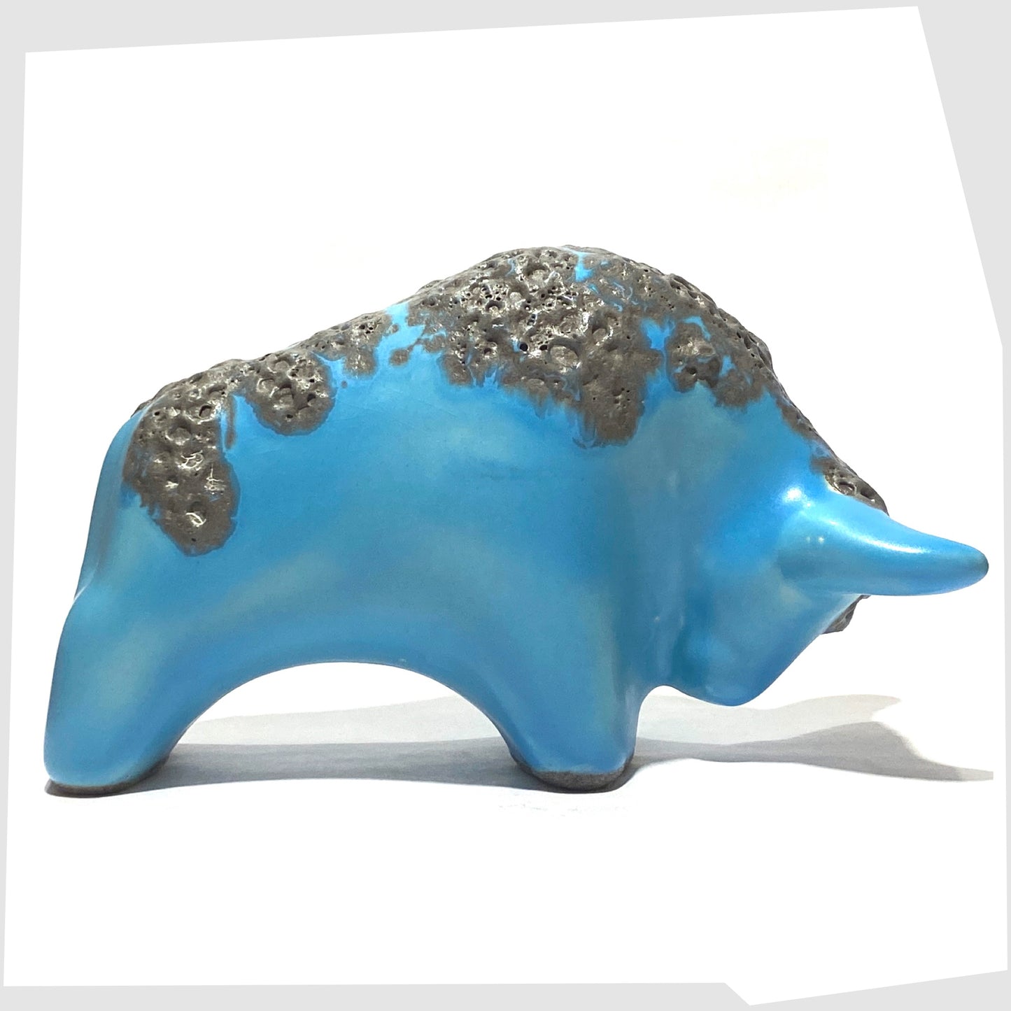 otto keramik bull in light blue glaze with grey fat lava along the spine