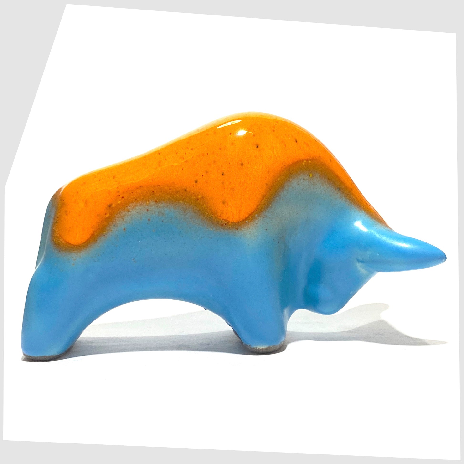 orange over light blue ceramic bull made by otto keramik, germany