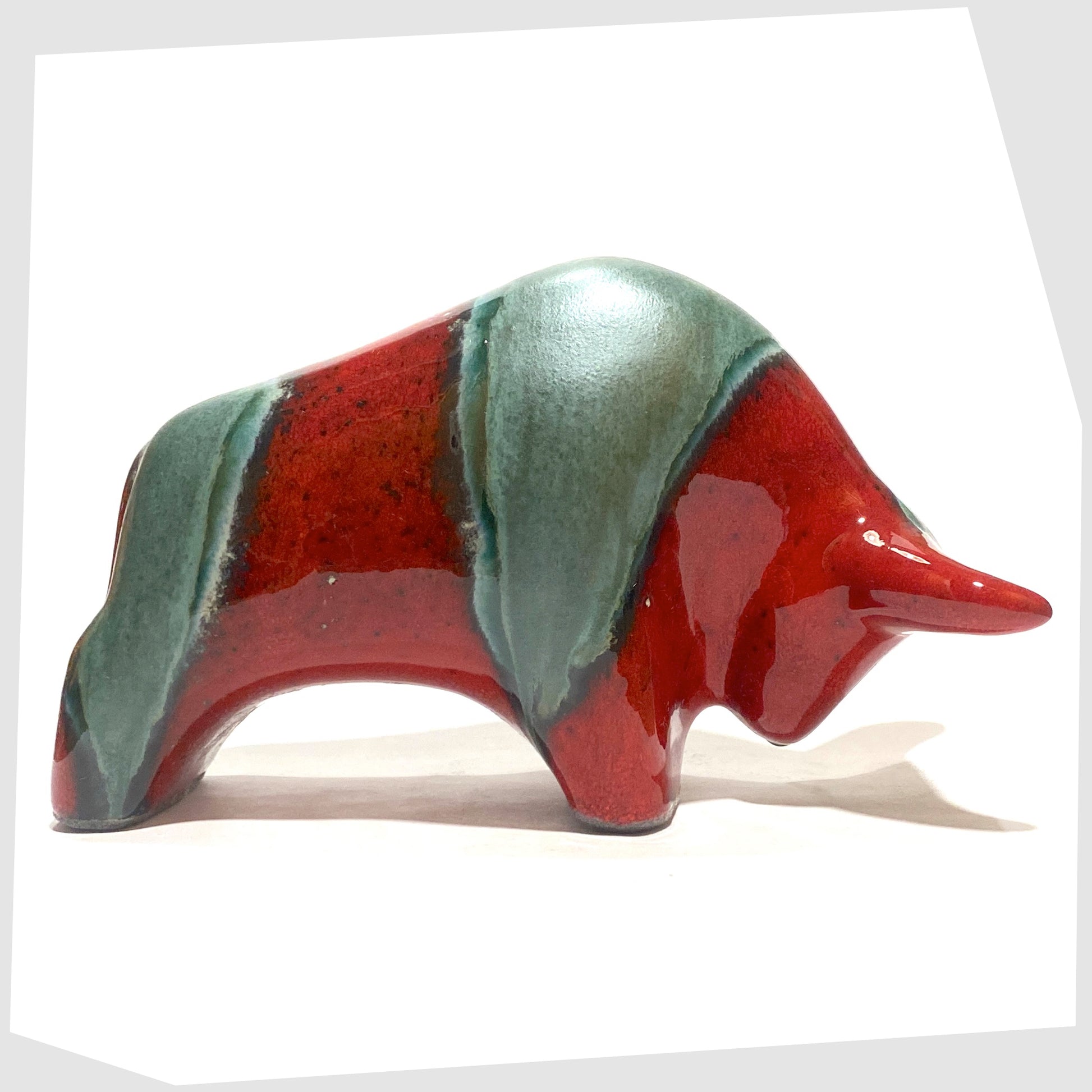 bull shaped ceramic sculpture made by otto keramik in bolivia glaze of red and sea green