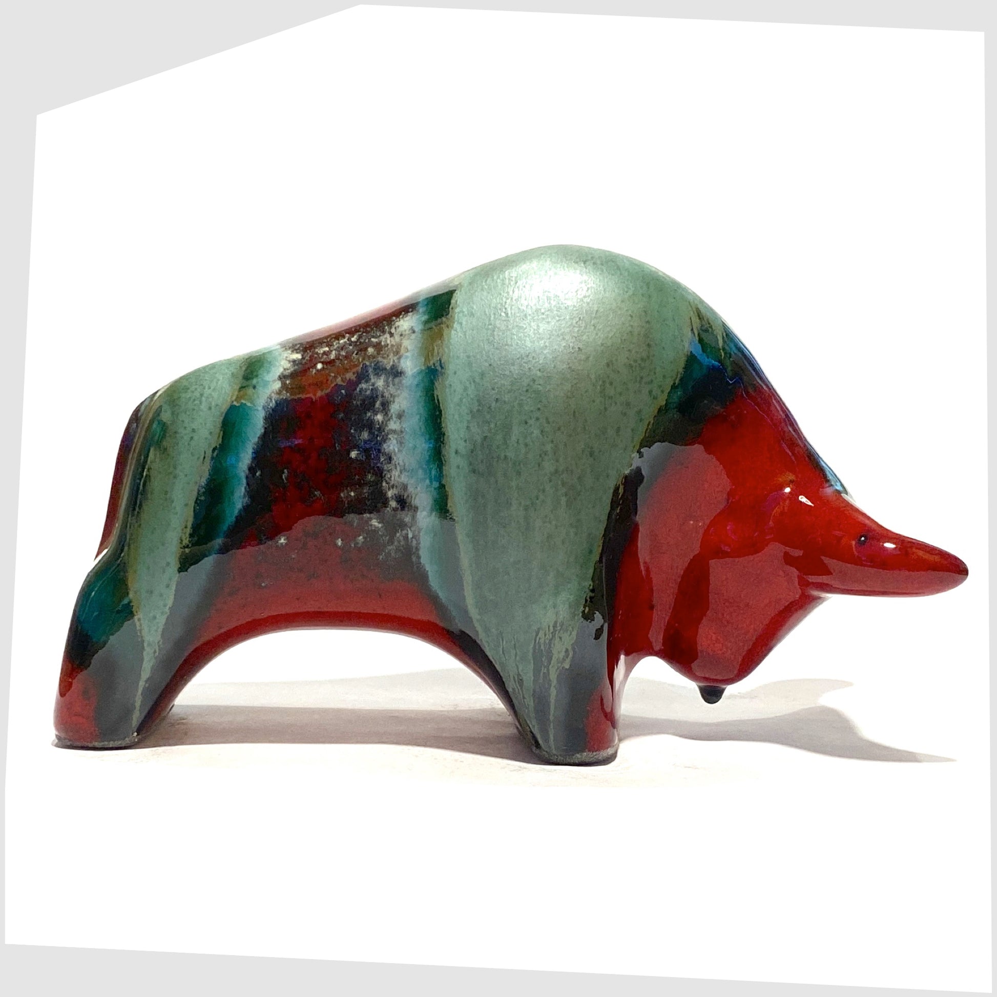 bull shaped ceramic sculpture made by otto keramik in bolivia glaze of red and sea green