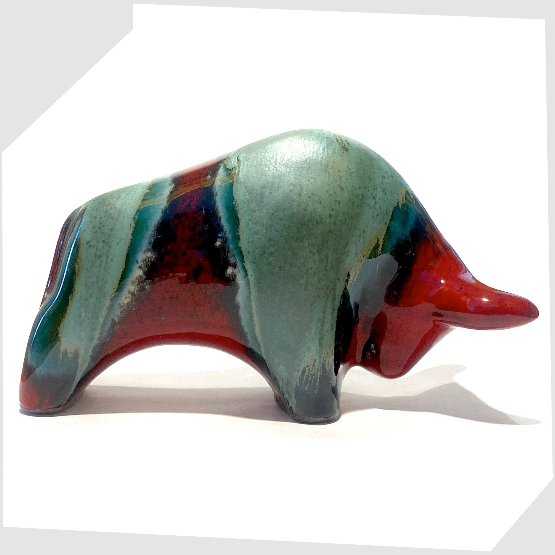 bull shaped ceramic sculpture made by otto keramik in bolivia glaze of red and sea green