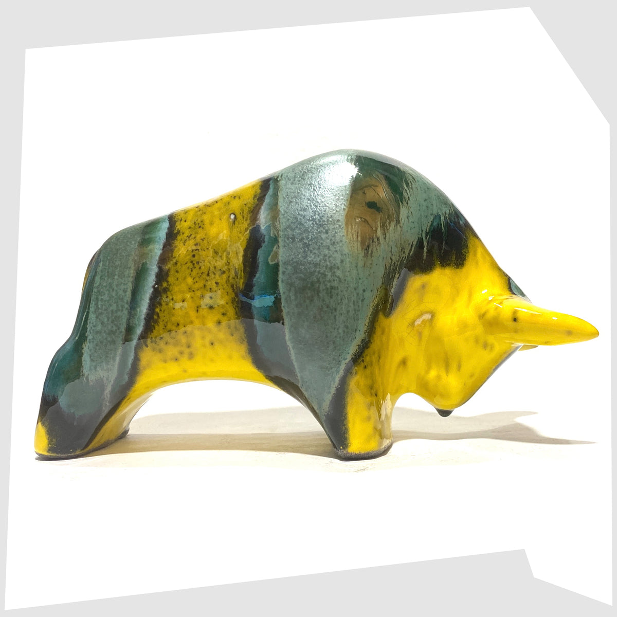 Otto Keramik Ceramic Bull sculpture in Brazil Glaze of yellow and sea green stripes, shown on a white background