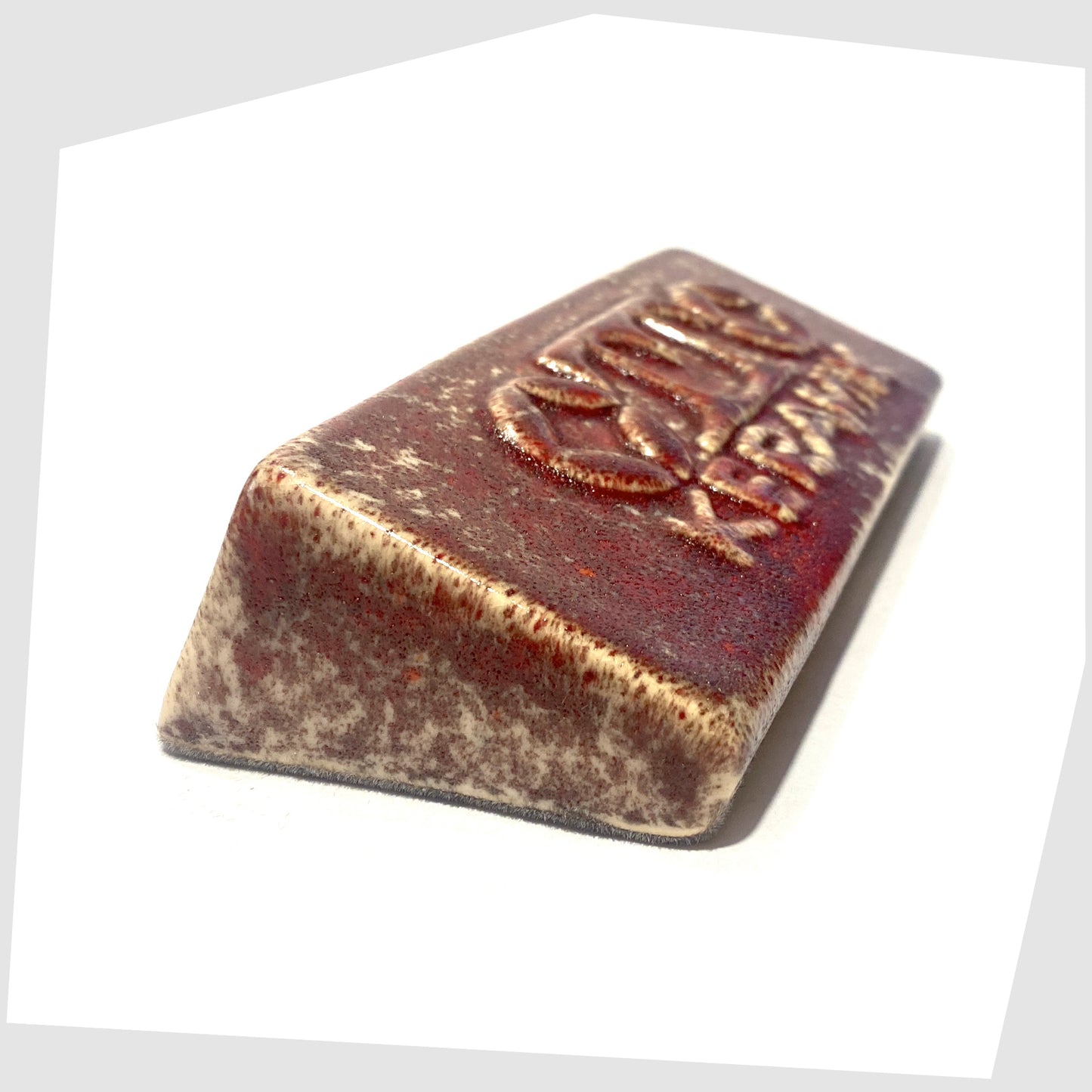 Otto Keramik ceramic display advertising brick in Molten Red speckled glaze