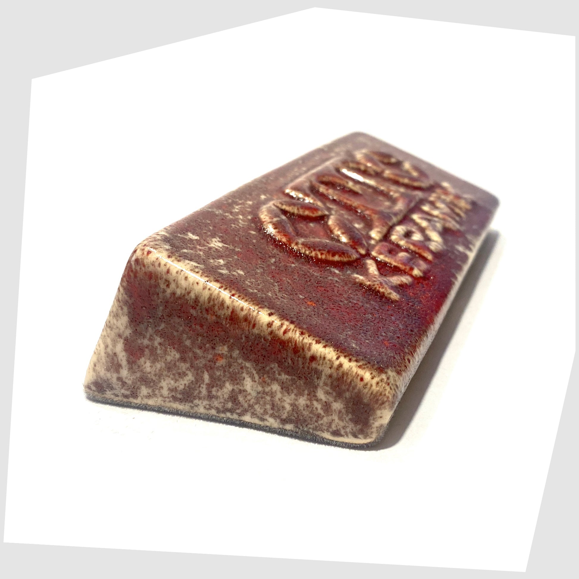 Otto Keramik ceramic display advertising brick in Molten Red speckled glaze