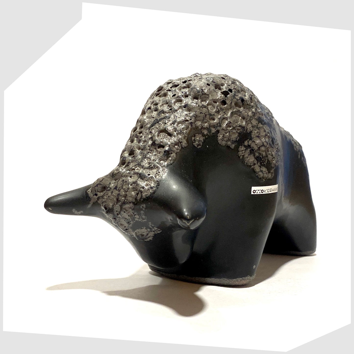 otto keramik bull in matte black with a textured band of fat lava glaze along the spine