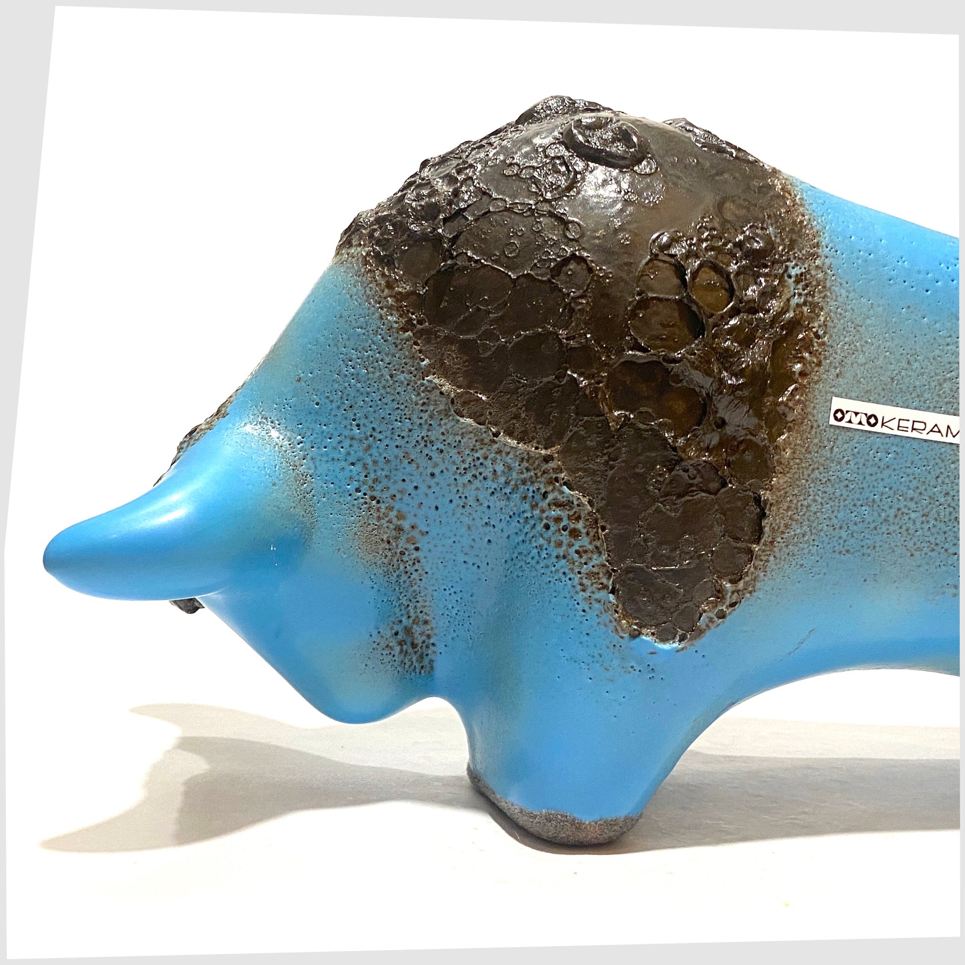front of the otto keramik bull in light blue glaze with striped of deep fat lava glaze