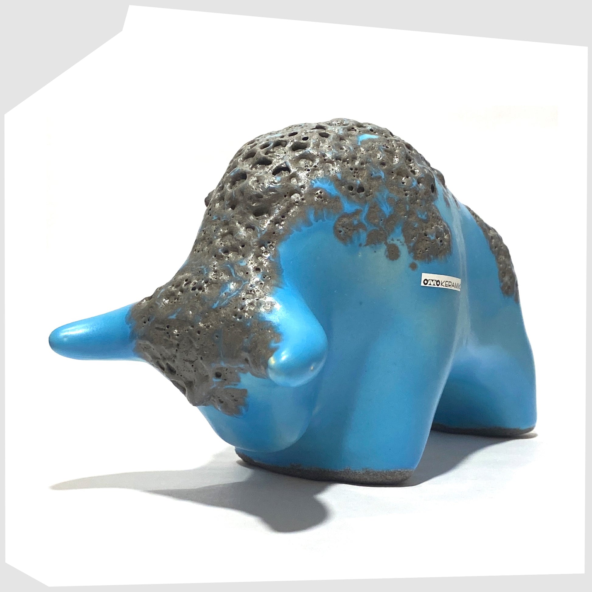 front of the otto keramik bull in light blue glaze with grey fat lava