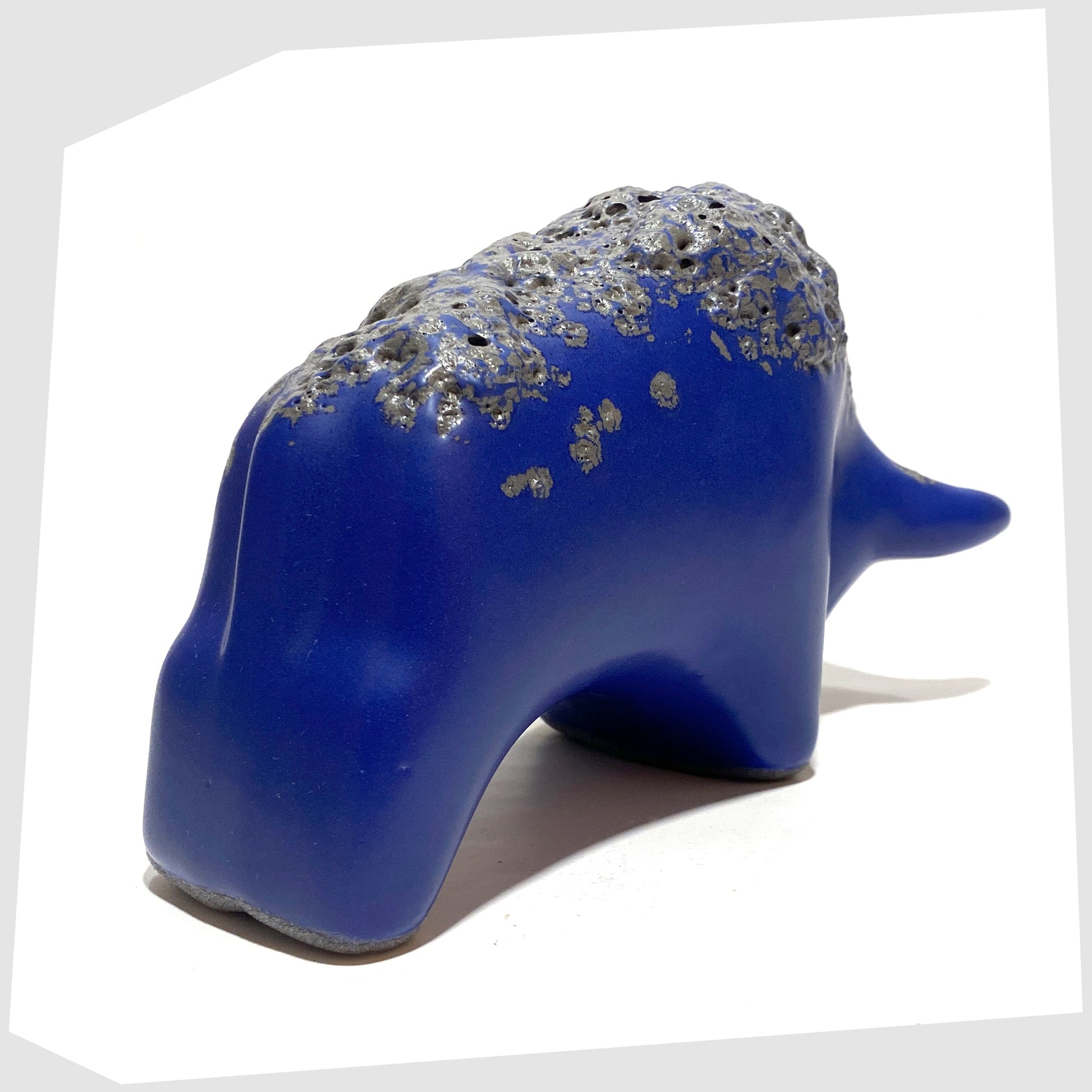 Rear of the Otto Keramik bull in blue glaze with deep textured fat lava glaze along the spine
