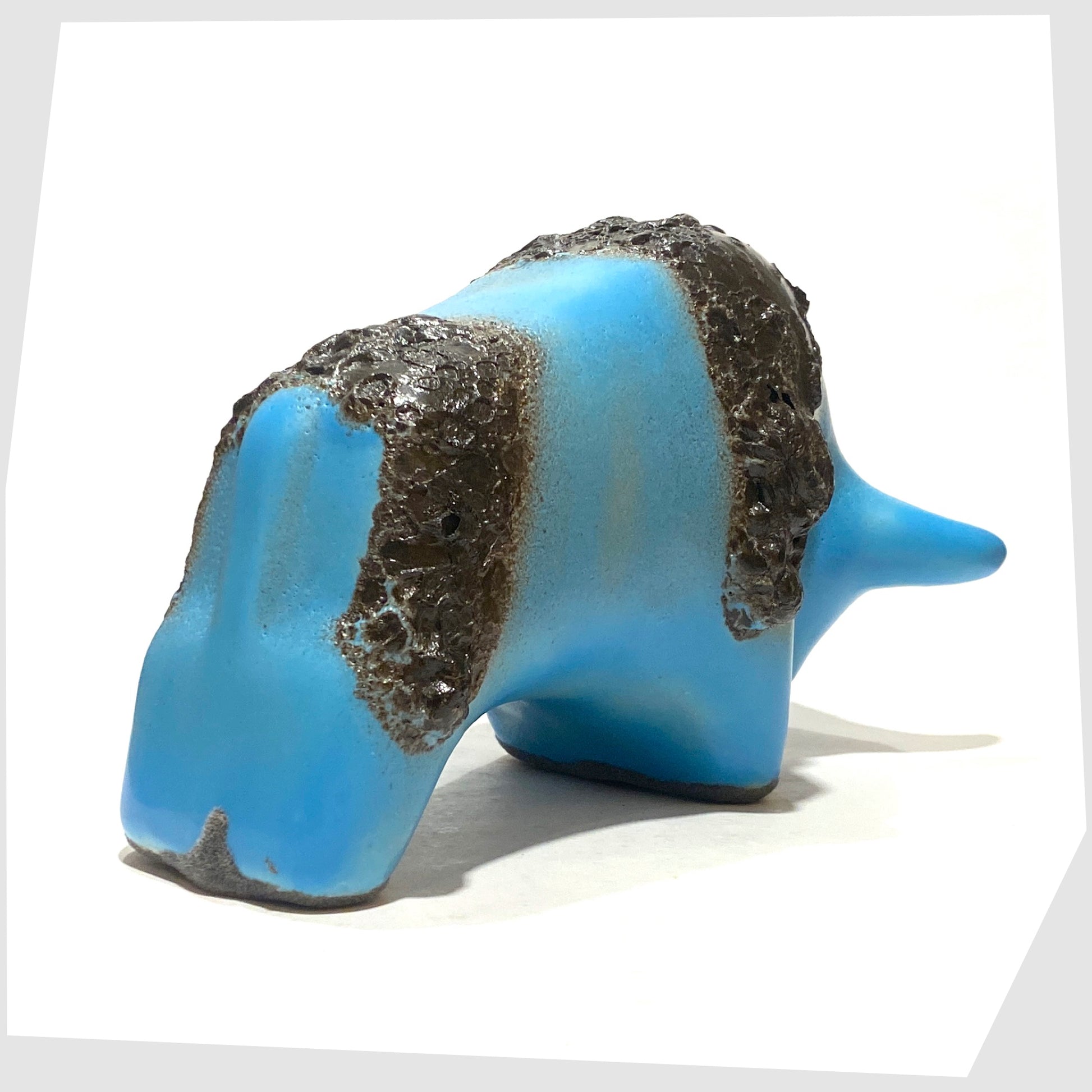 rear of the otto keramik bull in light blue glaze with striped of deep fat lava glaze