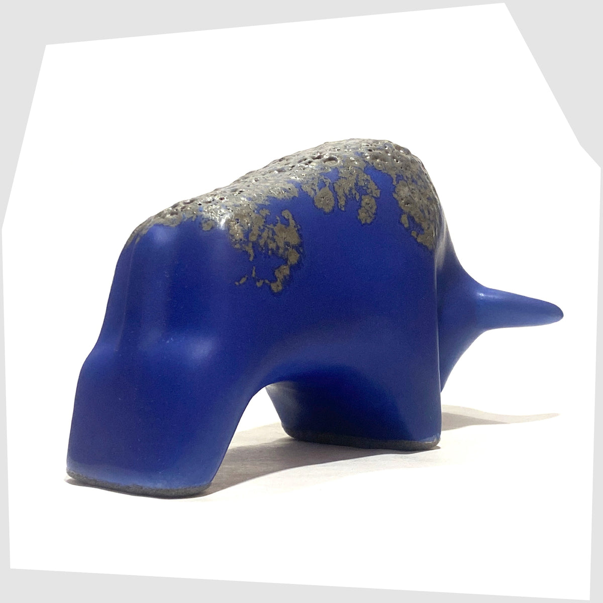 Rear of the Otto Keramik Bull-shaped ceramic ornament in blue with grey fat lava glaze, shown on a white background