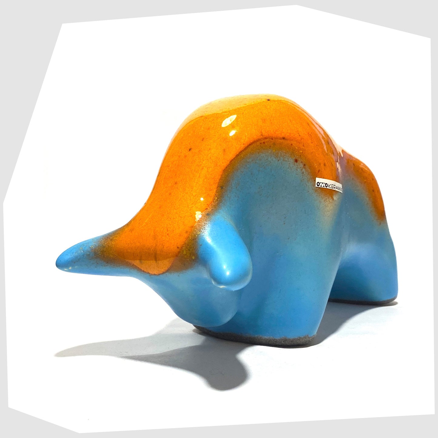 otto keramik pottery bull in orange drip glaze over a light blue base