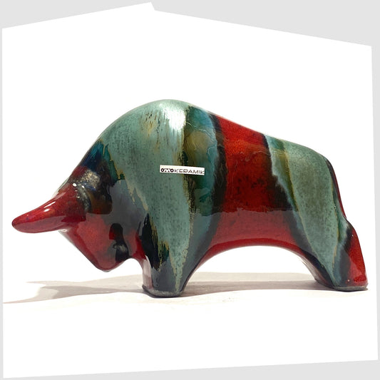 Otto Keramik Bull in Bolivia glaze of deep red with stripes of rich sea green, shown on a white background