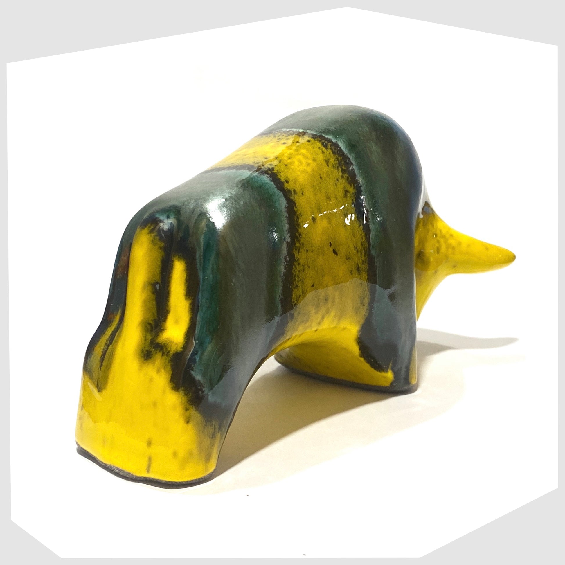 rear of the otto keramik bull ornament in brazil glaze of yellow and sea green glaze