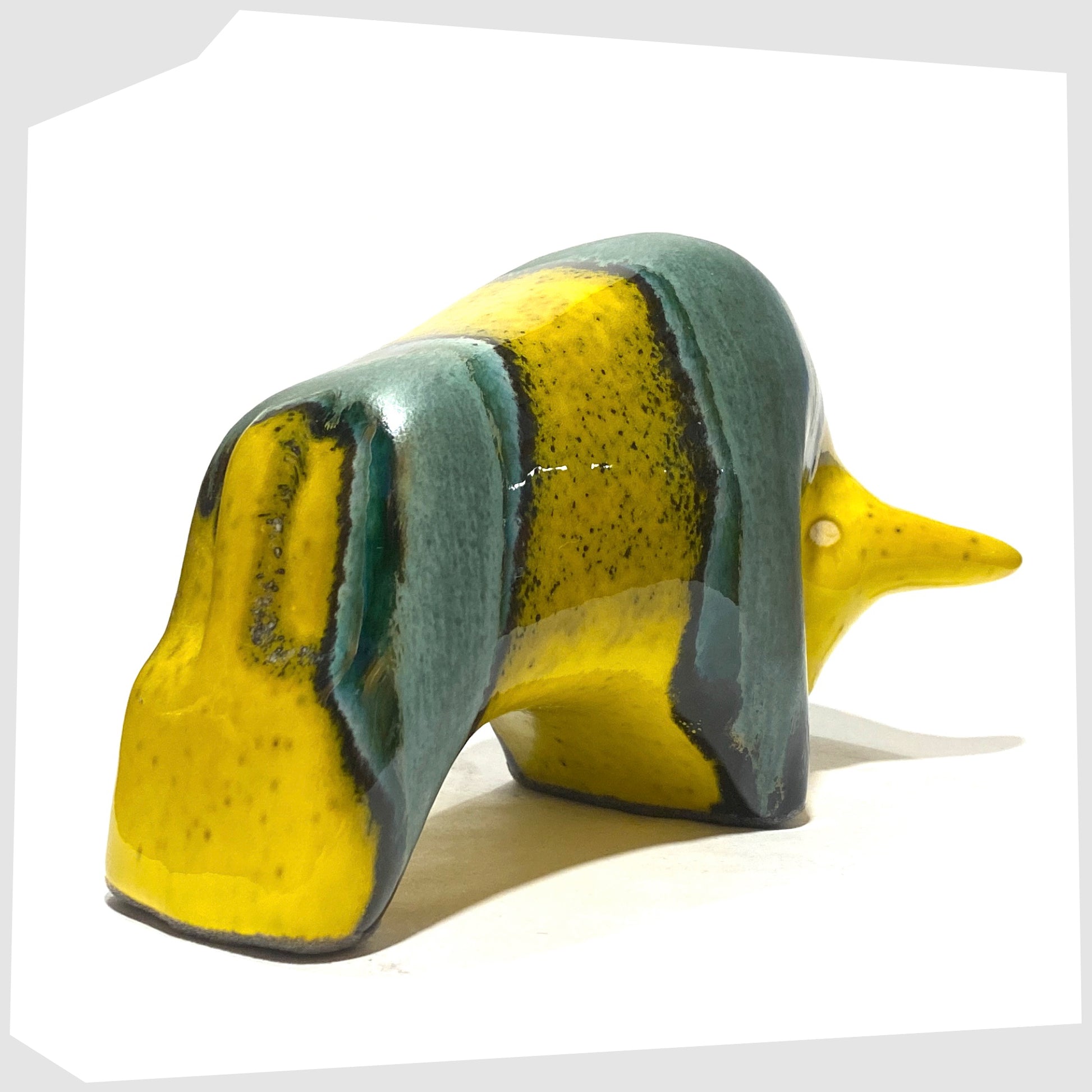 rear of the otto keramik bull ornament in brazil glaze of yellow and sea green glaze