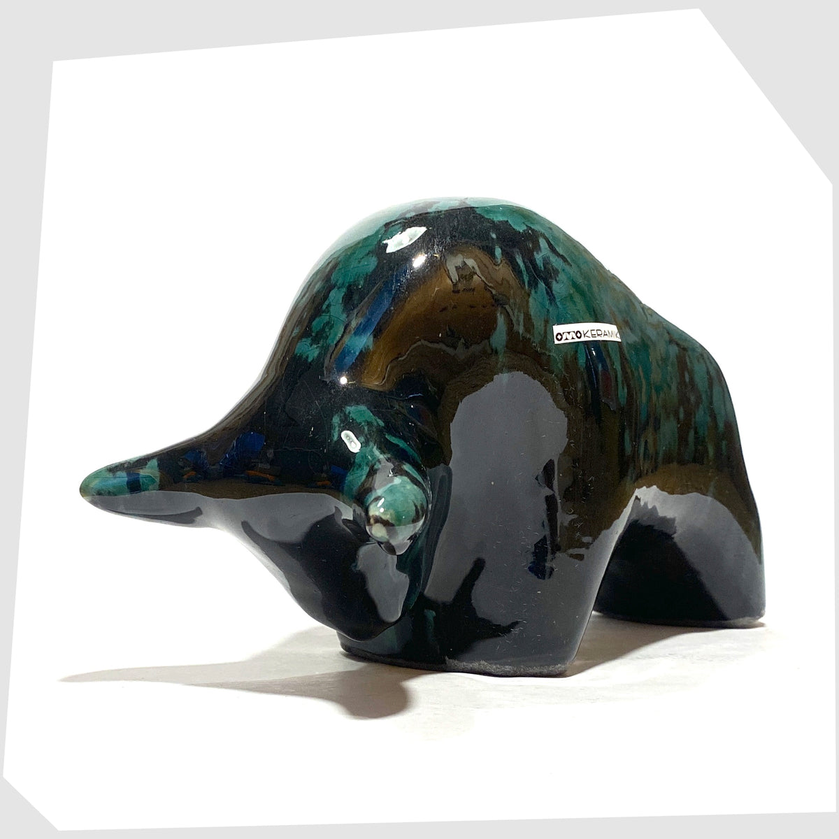 Otto Keramik Ceramic Bull in Ecuador glaze of gloss black and teal, shown on a white background