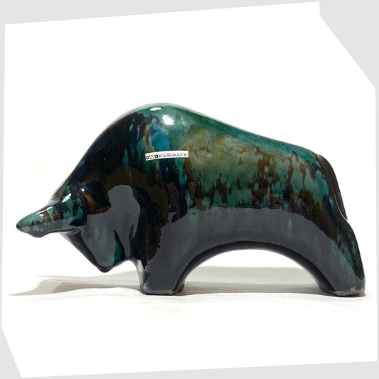 Otto Keramik Bull in Ecuador glaze of gloss black and teal, shown on a white background