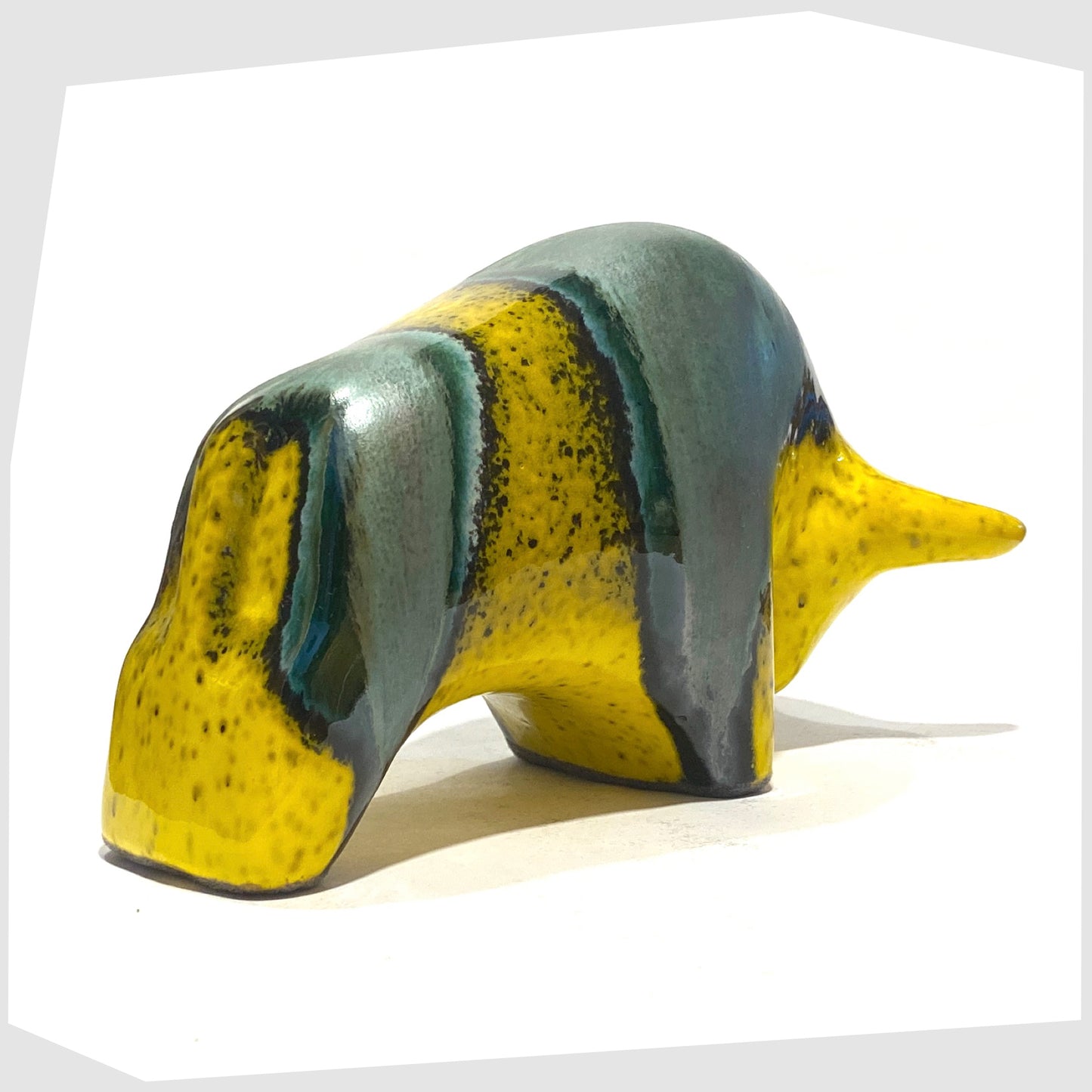 rear of the otto keramik bull ornament in brazil glaze of yellow and sea green glaze