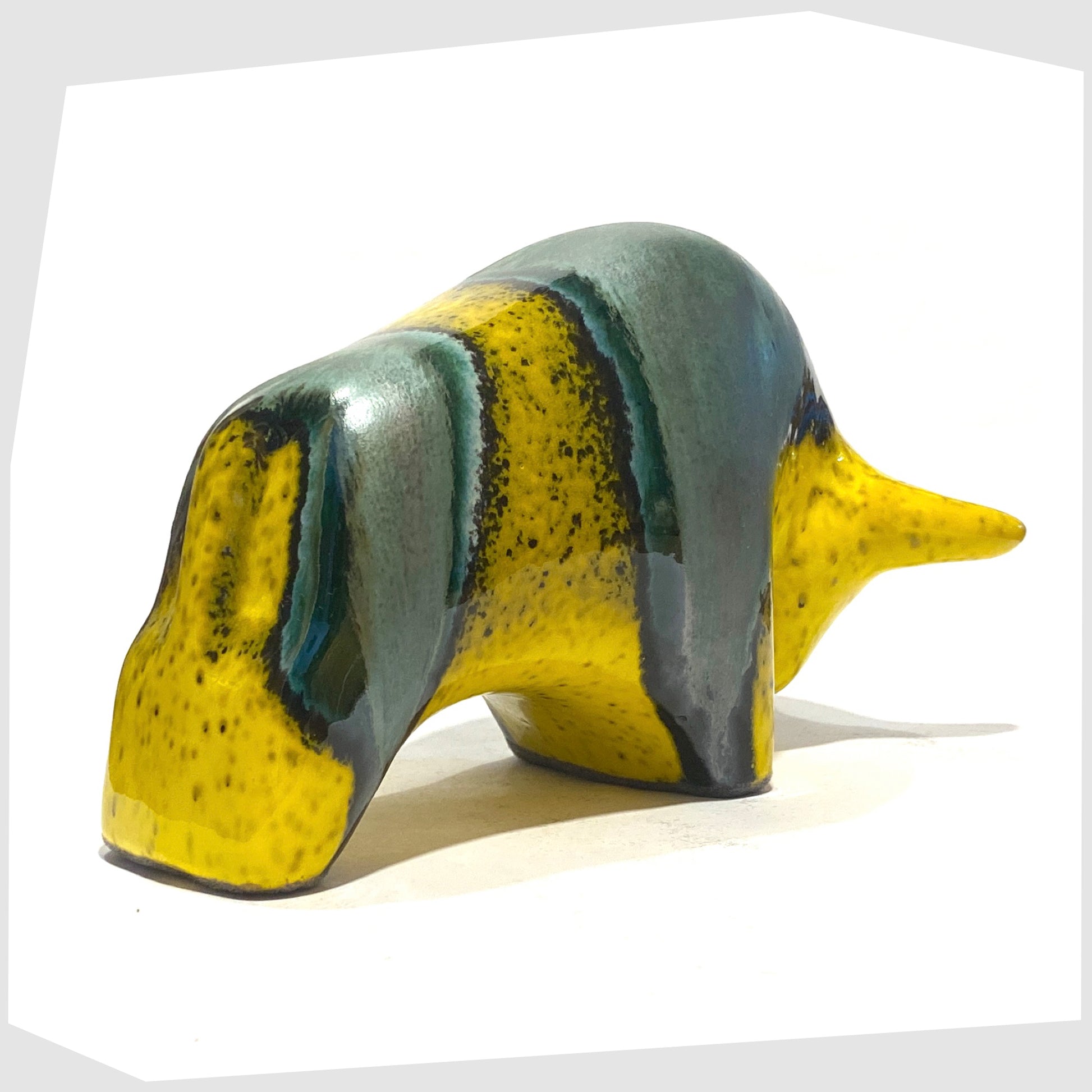 rear of the otto keramik bull ornament in brazil glaze of yellow and sea green glaze