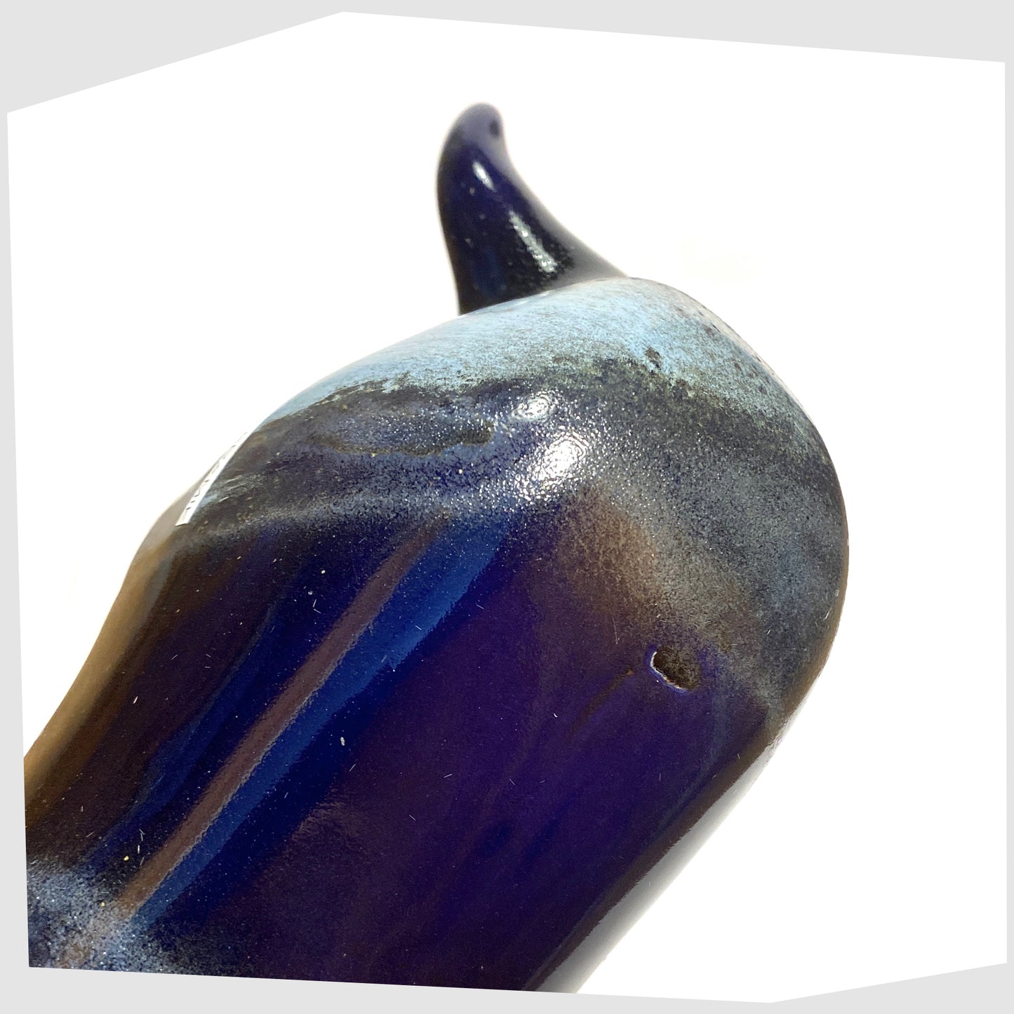 Glazing detail of the Otto Keramik Ceramic Bull in navy and blue Kreta glaze, shown on a white background