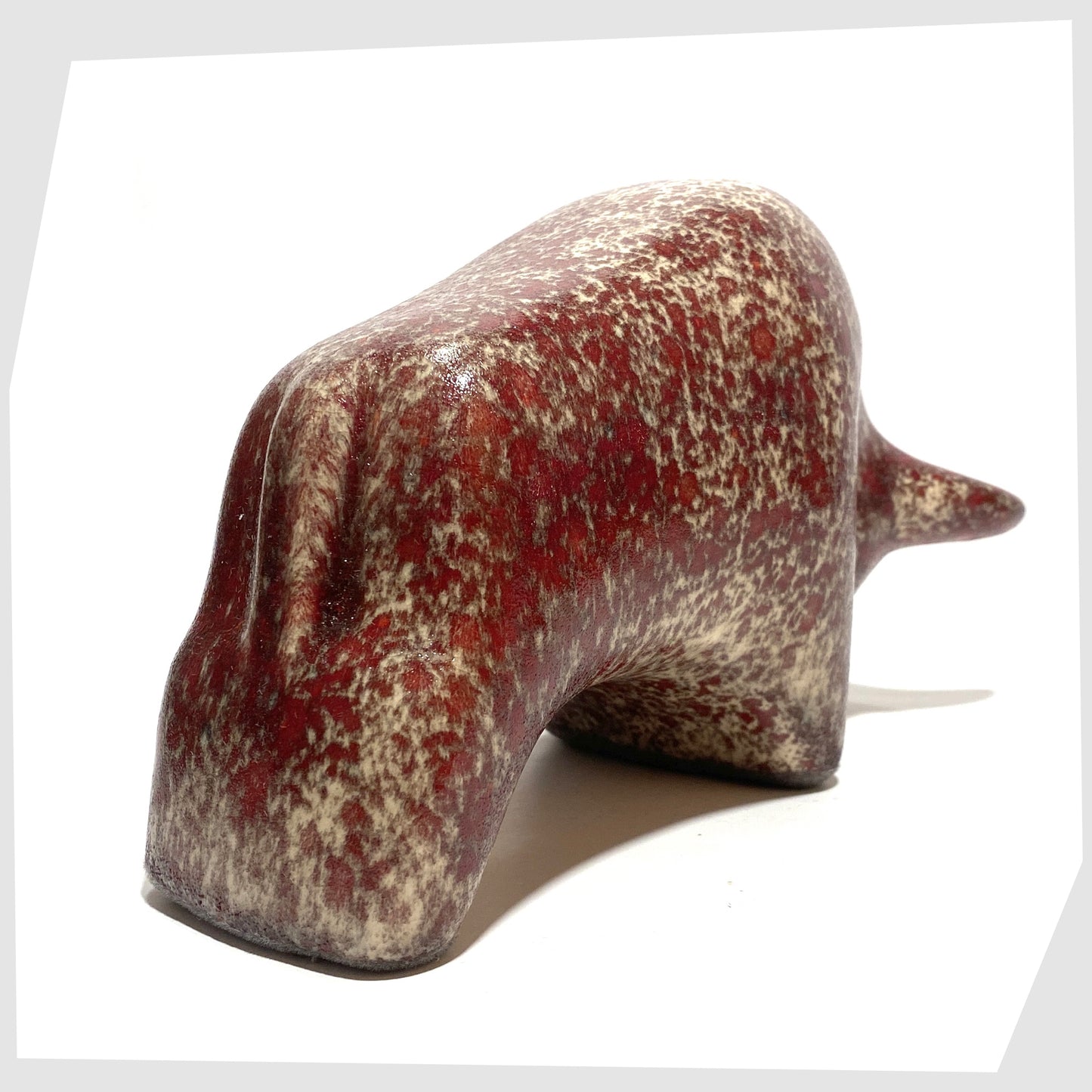 rear of the otto keramik bull in textured molten glaze of red and beige speckles 