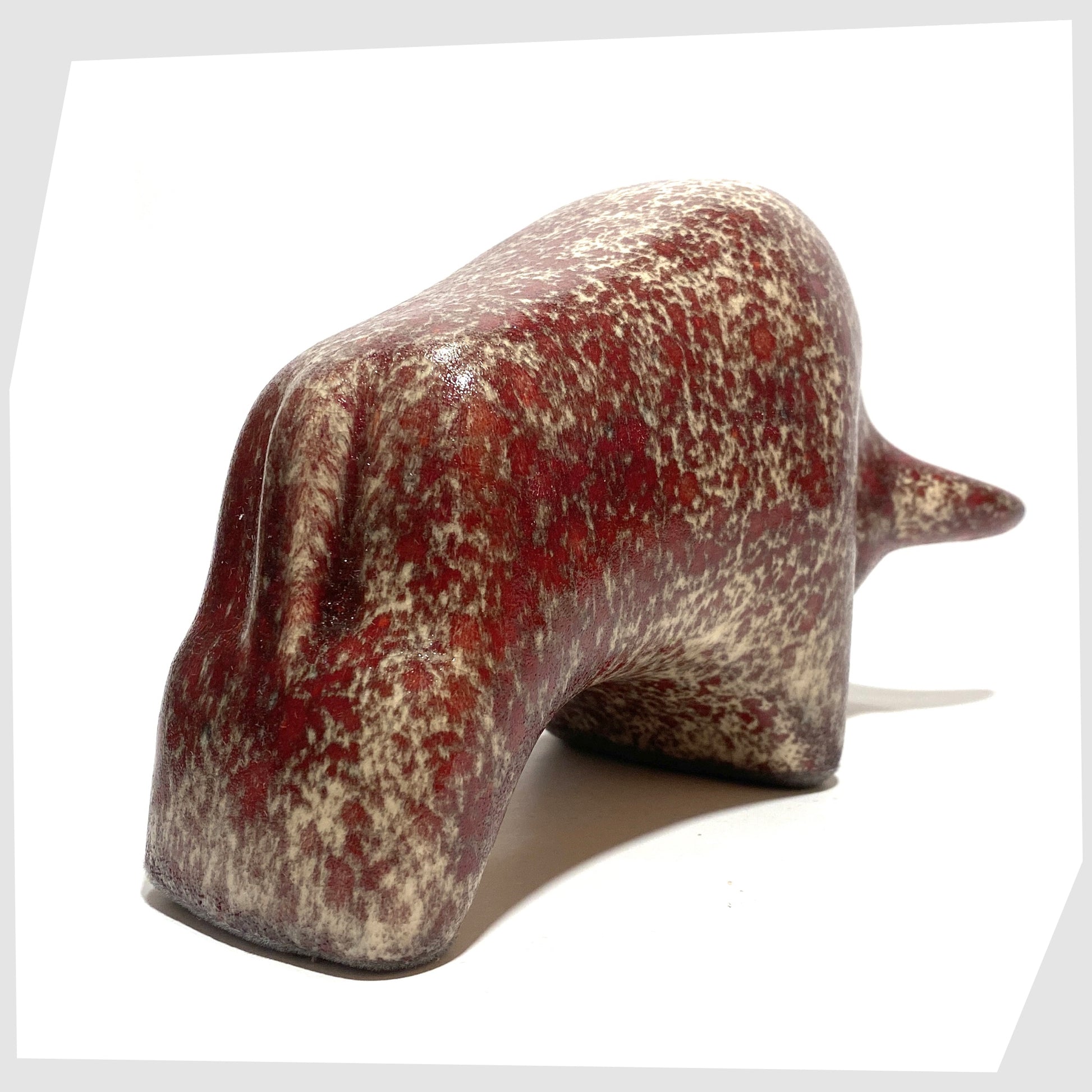 rear of the otto keramik bull in textured molten glaze of red and beige speckles 