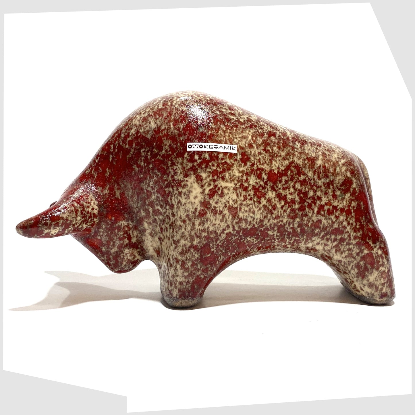 otto keramik bull in textured molten glaze of red and beige speckles 